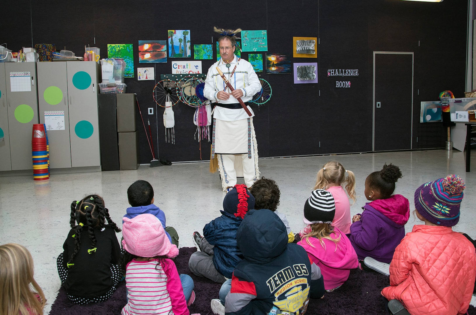 Edward Blauvelt, Joint Base San Antonio-Randolph Native American Indian Heritage Month Committee chairman, shares stories with children attending the Part Day Enrichment Program offered by the Child Development Program Nov. 14, 2014 at Joint Base San Antonio-Randolph’s Youth Center. The storytelling session at the youth center allowed him to communicate information on Native American Indian culture and pass on their stories. Throughout November, the nation will celebrate National Native American Indian Heritage Month. The month is set aside to recognize the significant contributions Native American Indians have made to the establishment and growth of the United States in the past and are still doing today. (U.S. Air Force photo by Johnny Saldivar)