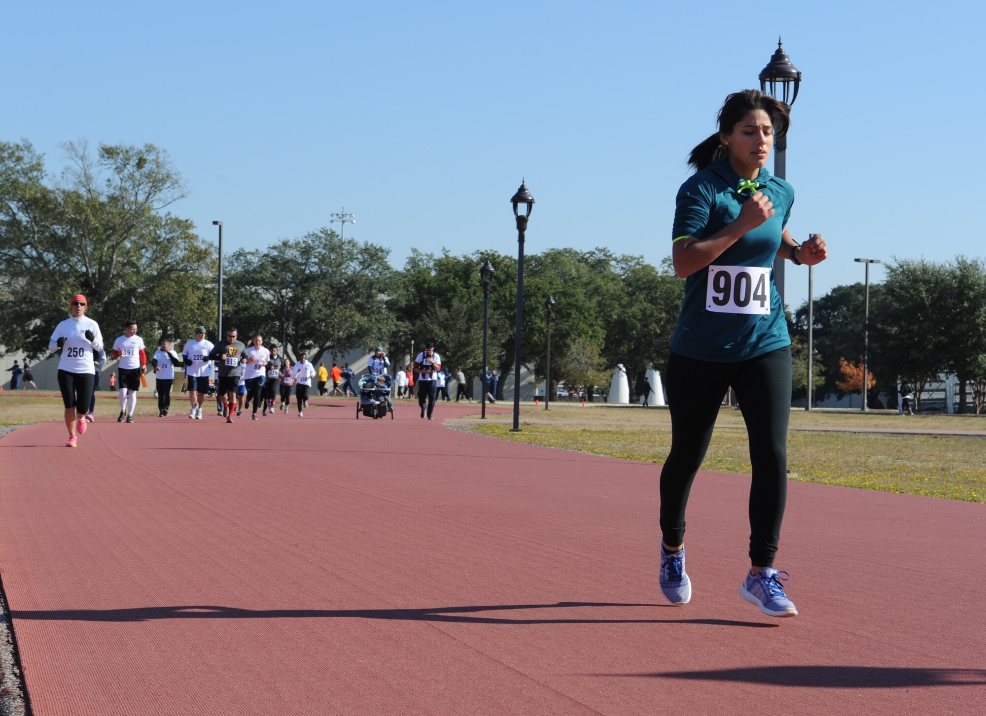Participants run during the second annual 5K for AJ Nov. 15, 2014, Keesler Air Force Base, Miss. The event raised more than $5,000 for the Disabled American Veterans Charity and drew approximately 300 participants. (U.S. Air Force photo by Senior Airman Holly Mansfield/Released)