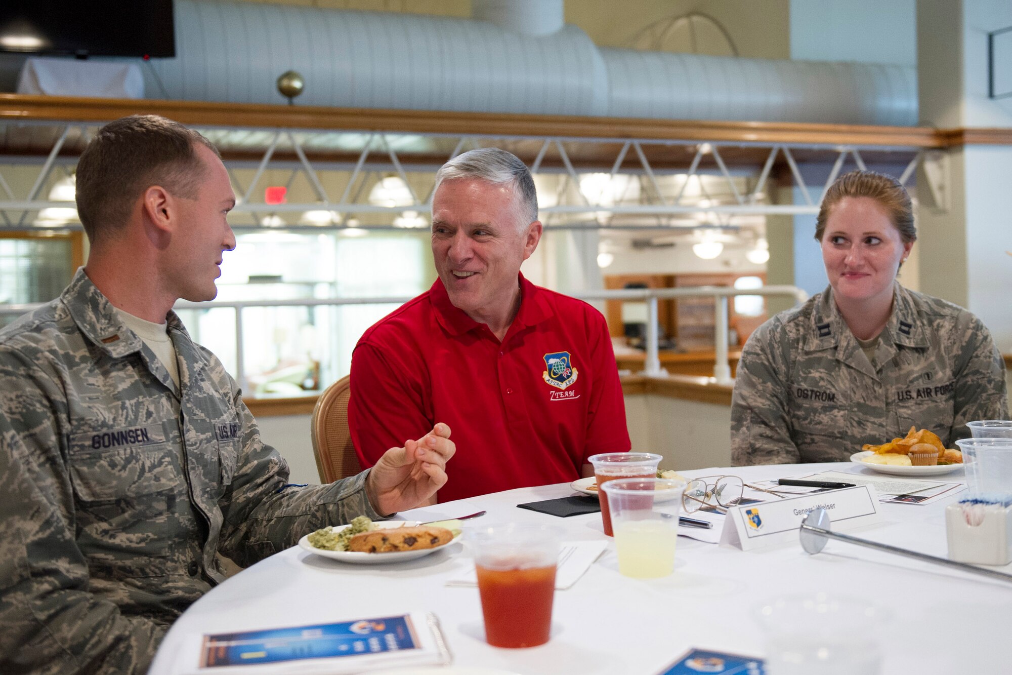 Retired Lt. Gen. William Welser III (center), speaks with 2nd Lt. Giles Gonnsen (left), and Capt. Sarah Ostrom, during a Bars to Stars Symposium at Patrick Air Force Base, Fla., Nov. 14, 2014.  The symposium is an aid to the Air Force mentoring program which focuses on total force development and preparing members for increased responsibilities as they progress through their career. (U.S. Air Force photo/Matthew Jurgens) (Released) 
