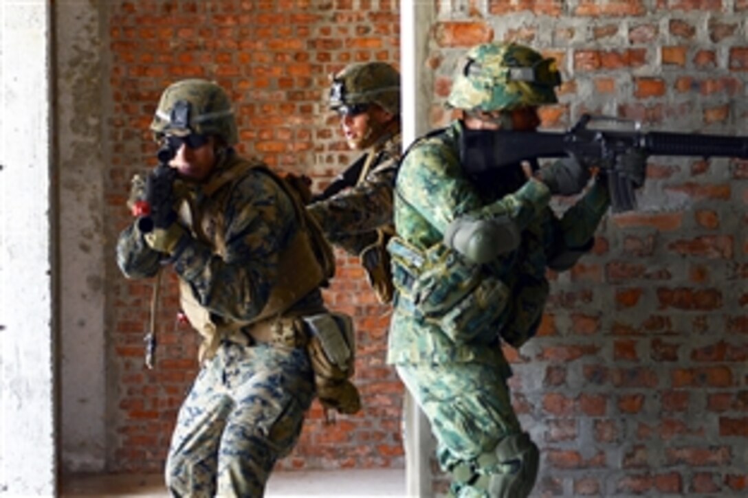 U.S. Marines and Royal Brunei Land Forces conduct military operations during Cooperation Afloat Readiness and Training Brunei 2014 on Camp Penanjong, Brunei, Nov. 13, 2014. The annual, bilateral exercise includes the U.S. Navy, U.S. Marine Corps and the armed forces of Bangladesh, Brunei, Cambodia, Indonesia, Malaysia, the Philippines, Singapore, Thailand and Timor-Leste.