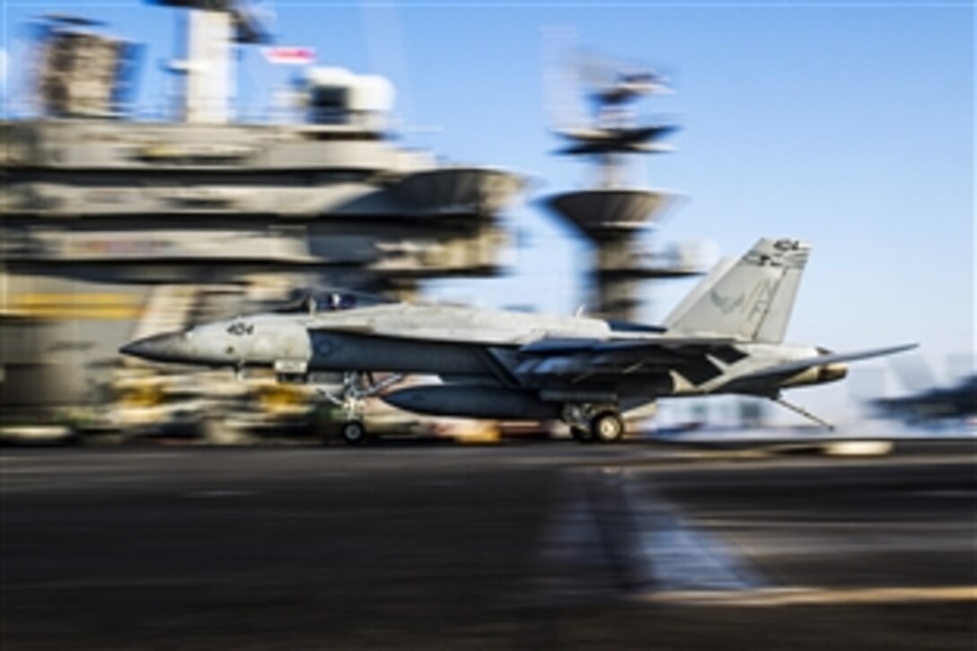 An F/A-18E Super Hornet makes an arrested landing on the flight deck of the aircraft carrier USS George Washington in the waters of southern Japan, Nov. 19, 2014. The F/A-18E Super Hornet is assigned to Strike Fighter Squadron 195.