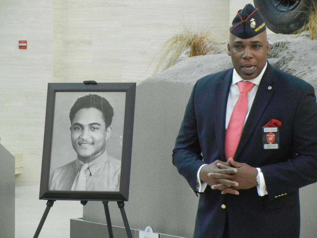 Eric Nelson, president of Quantico’s Montford Point Marine Association, Chapter 32, speaks about the late Cpl. Julius B. Foxx Jr. an original Montford Point Marine, during Friday’s ceremony at the National Museum of the Marine Corps. Foxx was posthumously awarded the Congressional Gold Medal for his service. His daughters accepted the award from U.S. Sen. Mark Warner (D-Va.) on their late father’s behalf.
