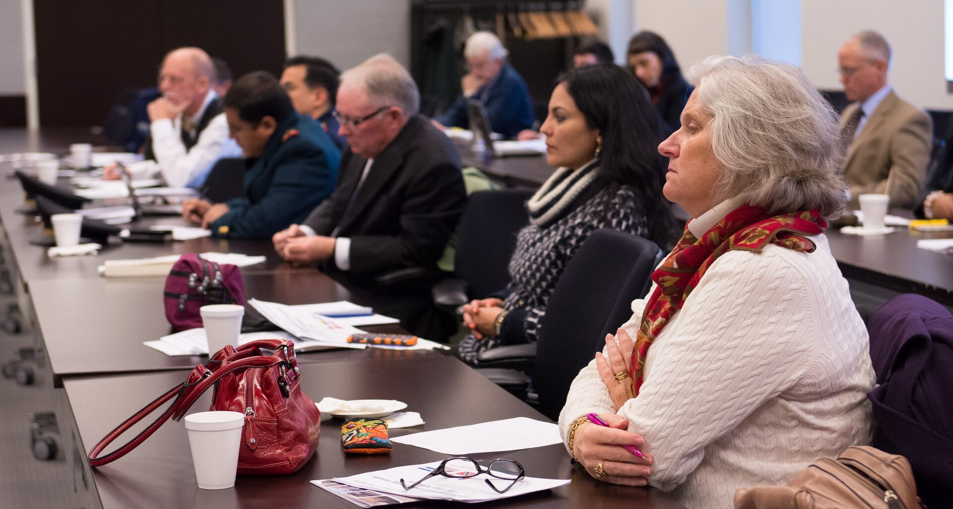 Members of the military, private sector and civil society listen to panel.