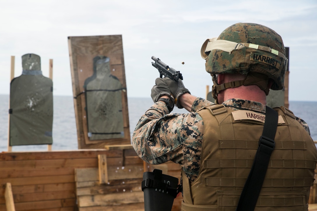 Cpl. Ransom W. Harrist fires the M9A1 9 mm service pistol Nov. 1 on the flight deck of the USNS Sacagawea. Marines trained with the service pistol and enhanced marksmanship fundamentals. The Marines are participating in T-AKE 14-2, a maritime pre-positioned force, multi-country theater security cooperation deployed from Okinawa aboard the USNS Sacagawea in the Asia-Pacific area of operations. Harrist, from Shallowater, Texas, is a landing support specialist with Combat Logistics Detachment 379, Headquarters Regiment, 3rd Marine Logistics Group, III Marine Expeditionary Force. 