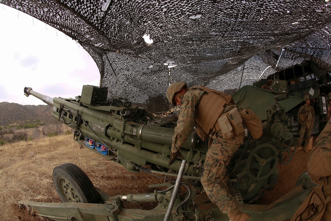 U.S. Marines with India Battery, Battalion Landing Team 3rd Battalion, 1st Marine Regiment, 15th Marine Expeditionary Unit, fire an M777A2 Lightweight Howitzer during MEU Exercise 14 aboard Camp Pendleton, Calif., Nov. 18, 2014. The purpose of MEUEX is to train the different elements of the 15th MEU to work together to complete a wide variety of missions. 