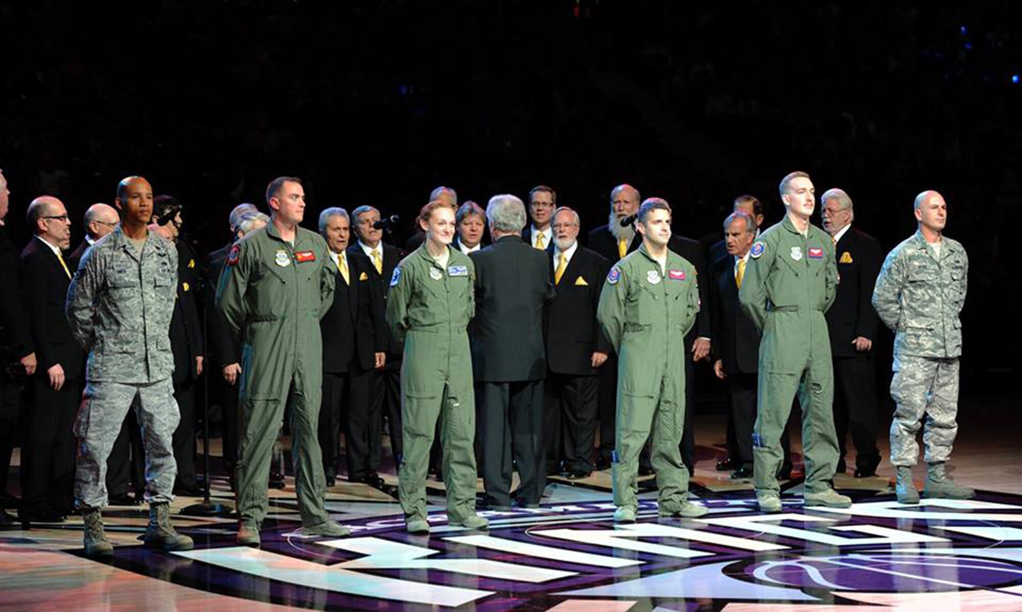 Airmen from Travis Air Force Base, Calif., are honored at halftime during the Sacramento Kings Military Appreciation Night at the Sleep Train Arena in Sacramento, Calif., Nov. 15, 2014. The Airmen recently returned home from overseas operations. (U.S. Air Force photo by Staff Sgt. Robert M. Trujillo/Released)
