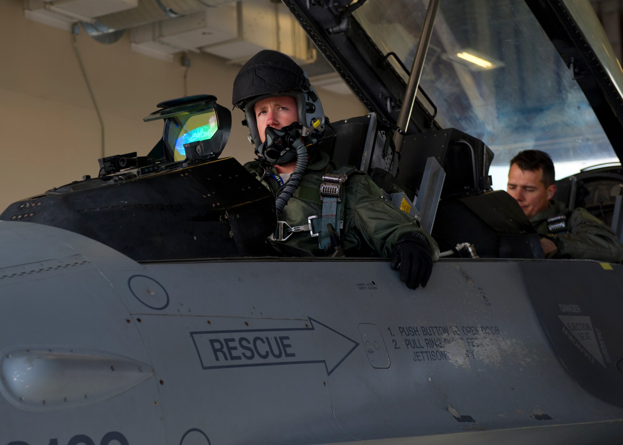 Lt. Col. Jerod Rick, 54th Fighter Group chief of standardization and evaluation and 1st Lt. Taylor Robert , a Basic Course student in the 311th Fighter Squadron, prepare to takeoff in an F-16 Fighting Falcon at Holloman Air Force Base, N.M., Nov. 13. Under the new training syllabus for the F-16, all students are prepared for the possibility of flying their first flight alone by training in 8 simulator sorties during their academic phase, including an Emergency Procedures Evaluation from an F-16 Flight Evaluator. (U.S. Air Force photo by Senior Airman Daniel E. F. Liddicoet/Released)