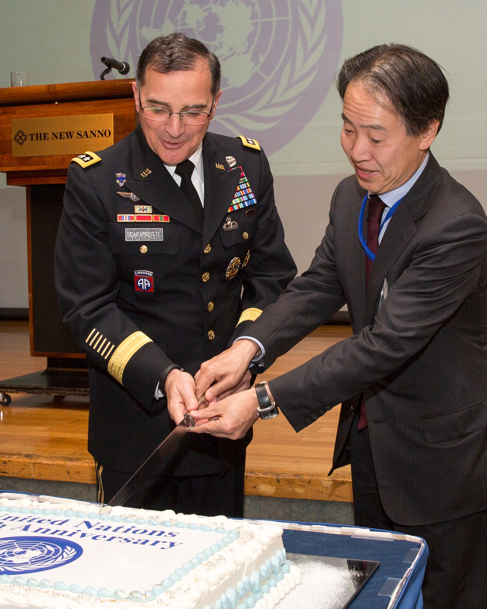 Army Gen. Curtis M. Scaparrotti, commander of United Nations Command, Combined Forces Command and U.S. Forces Korea, and Koji Tomita, Ministry of Foreign Affairs of Japan, North American Affairs Bureau director-general, cut the ceremonial cake to commemorate the 69th Anniversary of the United Nations, Nov. 18, 2014 at New Sanno Hotel, Tokyo, Japan. (U.S. Air Force photo by Osakabe Yasuo/Released)