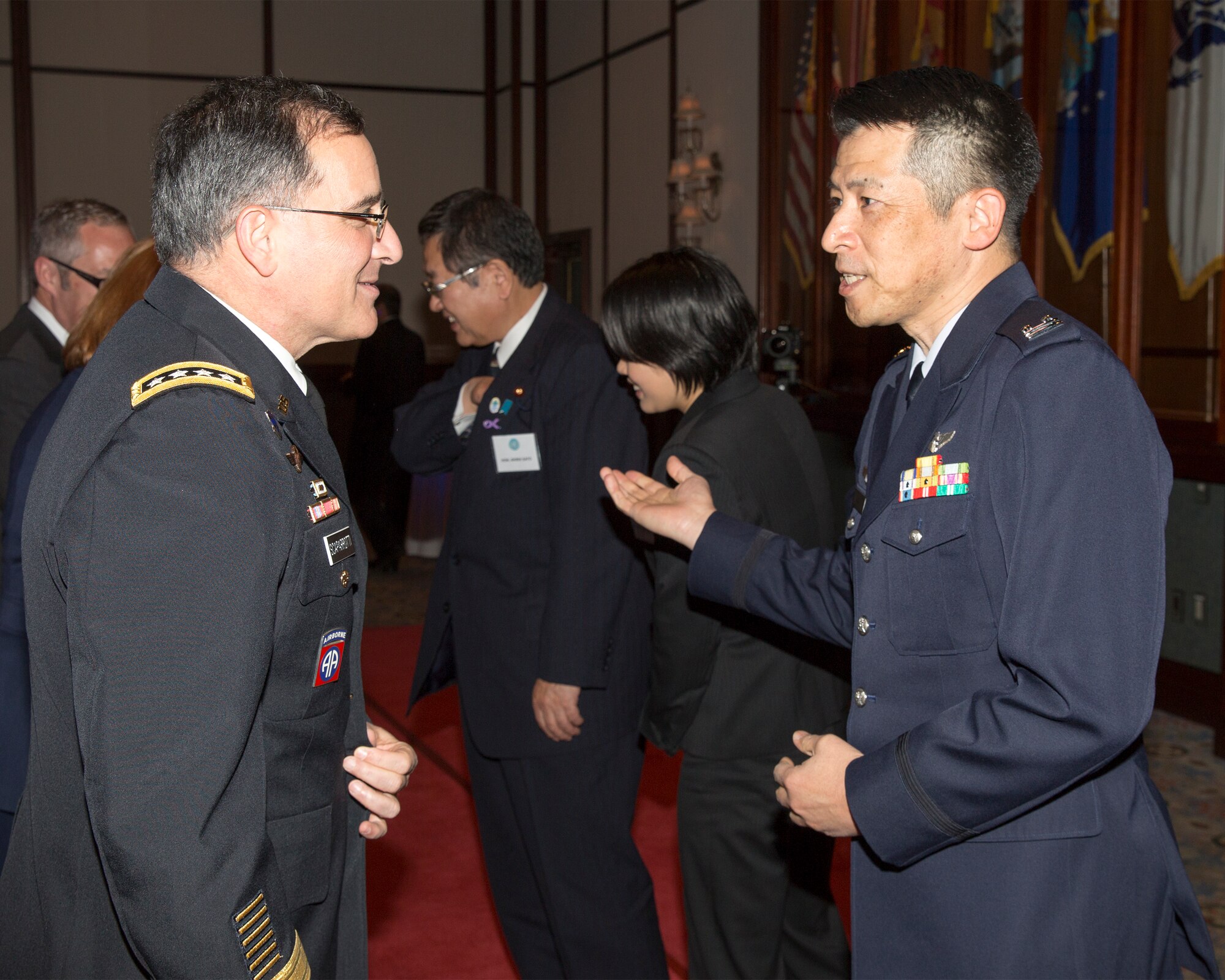 U.S. Army Gen. Curtis M. Scaparrotti, commander of United Nations Command, Combined Forces Command and U.S. Forces Korea, greets Japan Air Self-Defense Force Lt. Col. Yasuo Sakaki, 5th Air Force chief of JASDF liaison office, during the 69th Anniversary of the United Nations, Nov. 18, 2014 at New Sanno Hotel, Tokyo, Japan. The United Nations Command was established by UN Security Council Resolution 84 on July 7, 1950 in Tokyo. The command continues to support the Korean Armistice Agreement which was signed July 27, 1953, ending open hostilities. (U.S. Air Force photo by Osakabe Yasuo/Released)