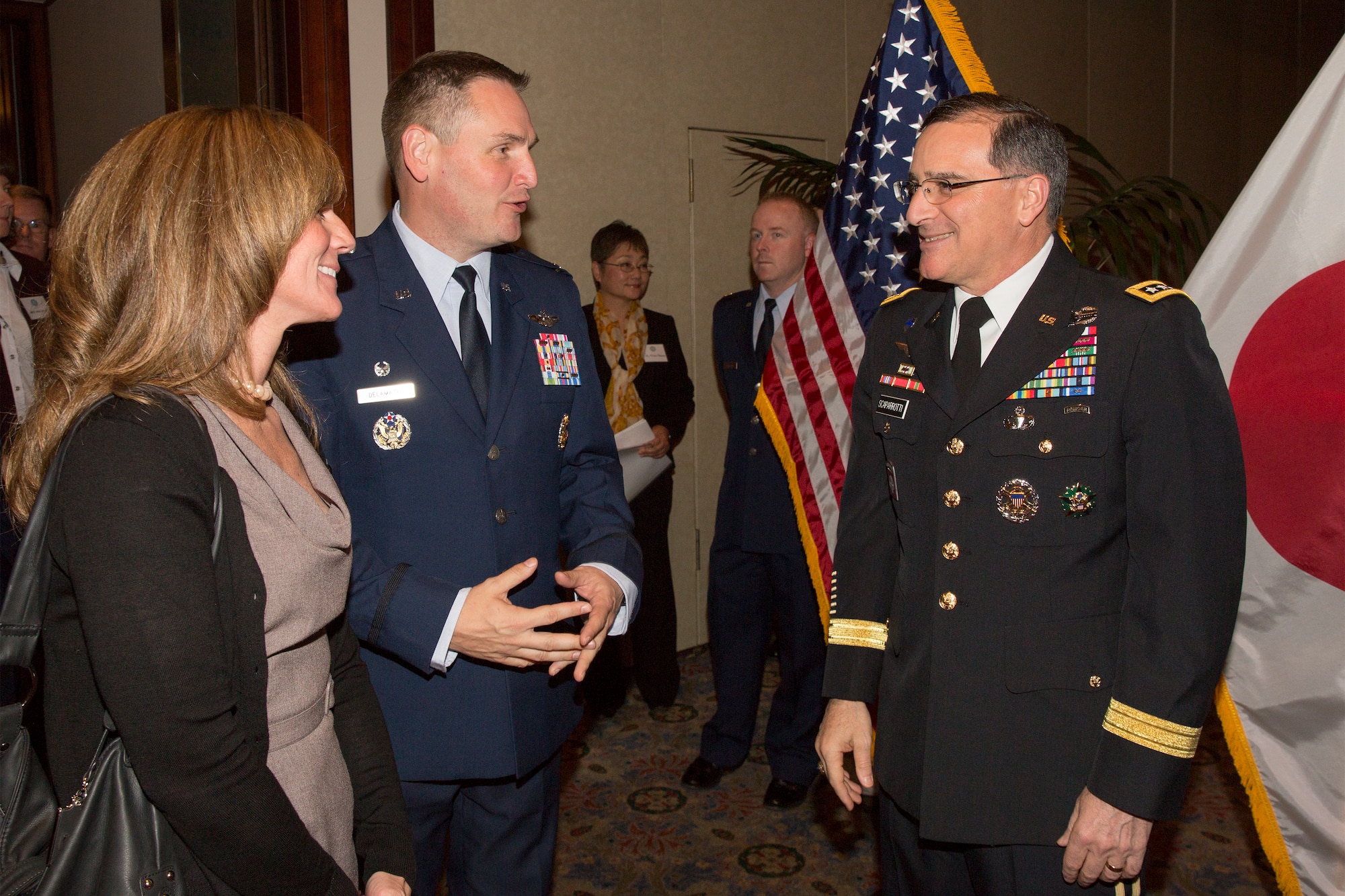 Army Gen. Curtis M. Scaparrotti, commander of United Nations Command, Combined Forces Command and U.S. Forces Korea, greets Air Force Col. Douglas Delamater, 374th Airlift Wing commander, and his wife Tricia, during the 69th Anniversary of the United Nations, Nov. 18, 2014 at New Sanno Hotel, Tokyo, Japan. The United Nations Command was established by UN Security Council Resolution 84 on July 7, 1950 in Tokyo. The command continues to support the Korean Armistice Agreement which was signed July 27, 1953, ending open hostilities. (U.S. Air Force photo by Osakabe Yasuo/Released)