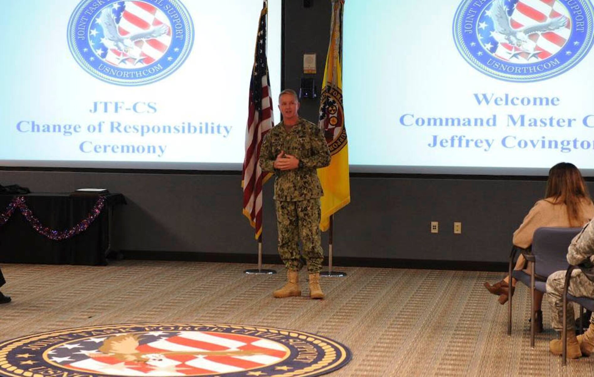 U.S. Navy Command Master Chief Jeffrey Covington, incoming Joint Task Force Civil Support senior enlisted leader, addresses the members of JTF-CS for the first time during a change of responsibility ceremony at Fort Eustis, Va., Nov. 14, 2014. JTF-CS anticipates, plans and prepares for chemical, biological, radiological, and nuclear response operations. (Official DOD photo by U.S. Navy Petty Officer 1st Class Brian Dietrick)
