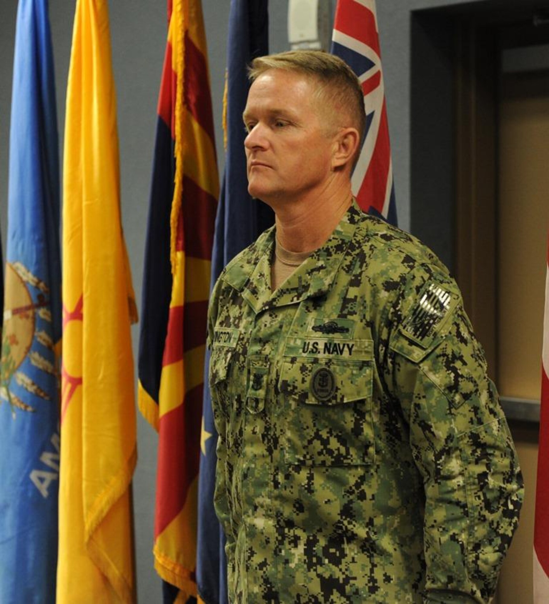 U.S. Navy Command Master Chief Jeffrey Covington, incoming JTF-CS senior enlisted leader, stands at attention during a change of responsibility ceremony at Fort Eustis, Va., Nov. 14, 2014. During the ceremony, U.S. Army Command Sgt. Maj. Richard Capps, outgoing JTF-CS senior enlisted leader, relinquished responsibility and turned it over to Covington. (Official DOD photo by U.S. Navy Petty Officer 1st Class Brian Dietrick)