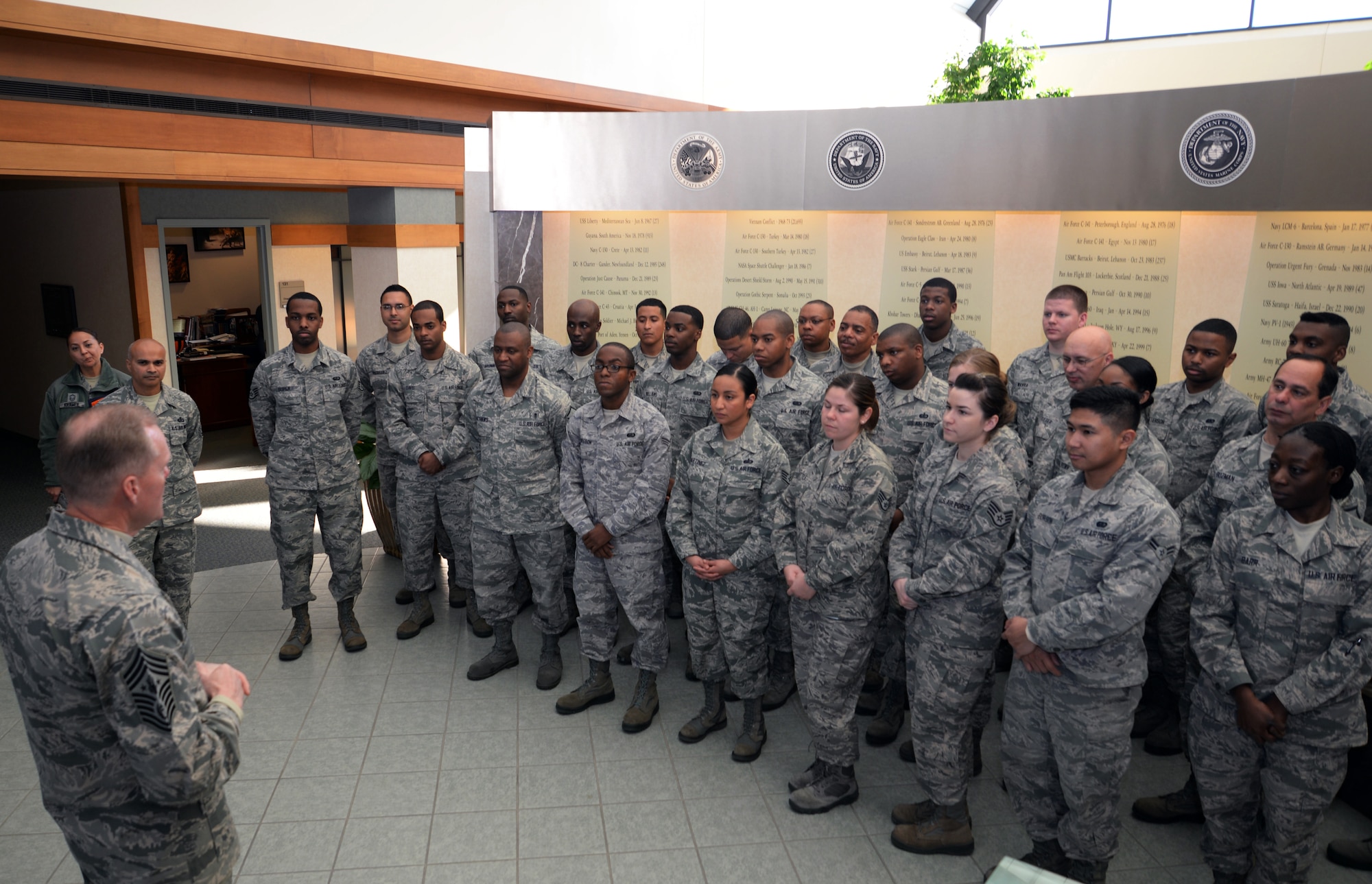 Chief Master Sgt. of the Air Force James A. Cody talks to Airman at Air Force Mortuary Affairs Operations during his visit to Dover AFB, Del. on Nov. 18, 2014. He spoke with Airmen about the importance of the AFMAO mission and the support they provide to the fallen and families of the fallen. (U.S. Air Force photo/Staff Sgt. John Ayre/Released)