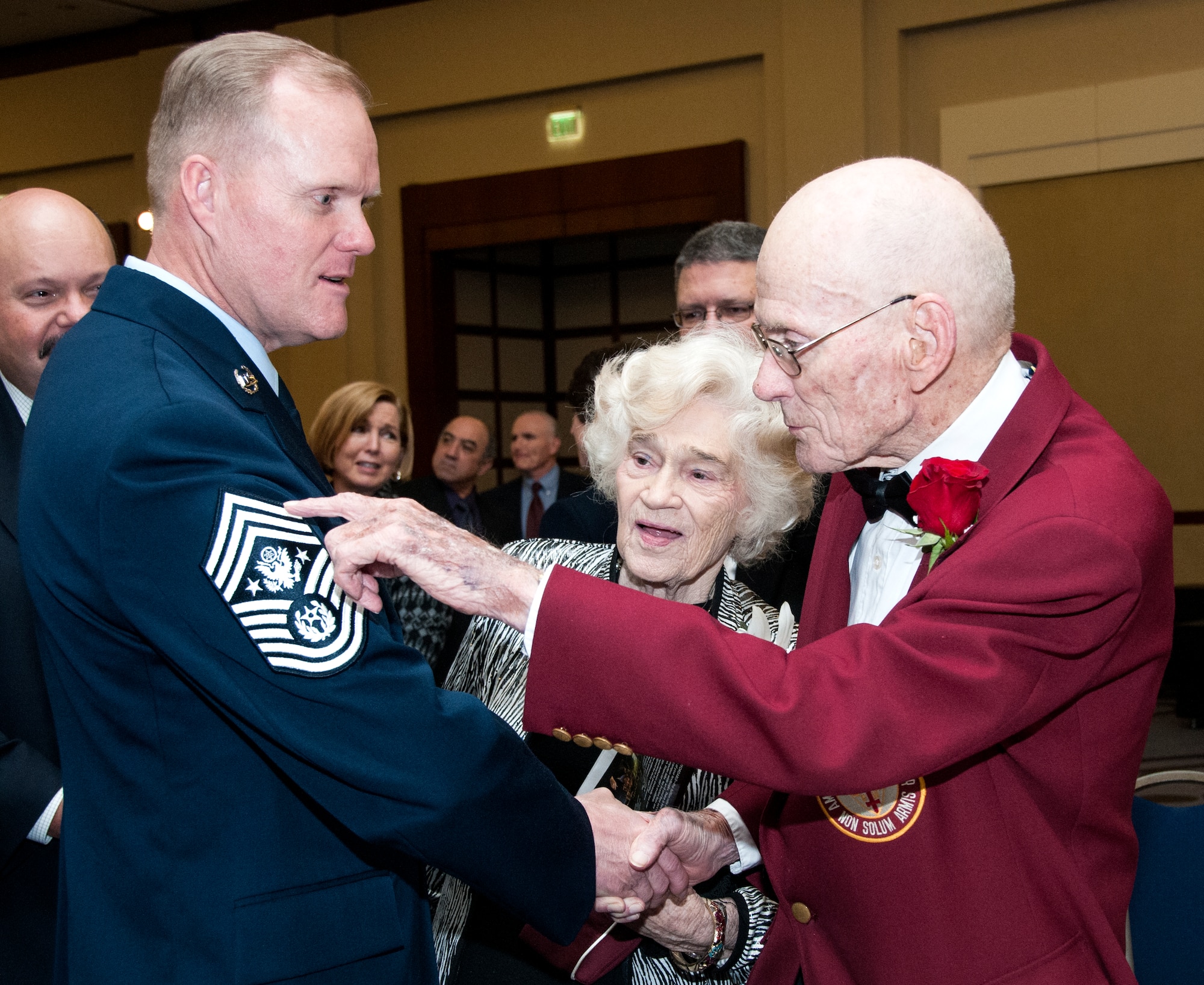 Chief Master Sgt. of the Air Force James A. Cody talks with Don Scott, a B-17 bomber crew member and Prisoner of War from WWII, at the Atlanta Regional Military Appreciation Committee in Marietta, Ga. Nov. 17, 2014. Cody spoke the ARMAC for its 62nd annual luncheon. (U.S. Air Force photo by Senior Airman Daniel Phelps/Released)