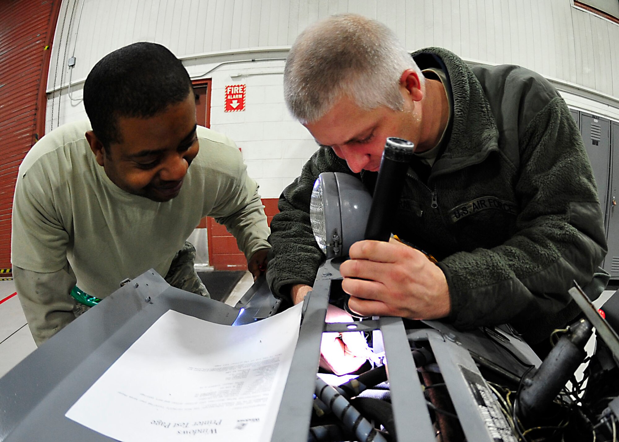 U.S. Air Force Staff Sgt. Jamaal Blakeney, 1st Maintenance Squadron Aerospace Ground Equipment technician, performs a Phase II inspection on a bomb lift at Langley Air Force Base, Va., Nov. 19, 2014. For its yearly inspection, bomb lifts are taken apart completely, inspected and put back together. (U.S. Air Force photo by Airman 1st Class Breonna Veal/Released) 
