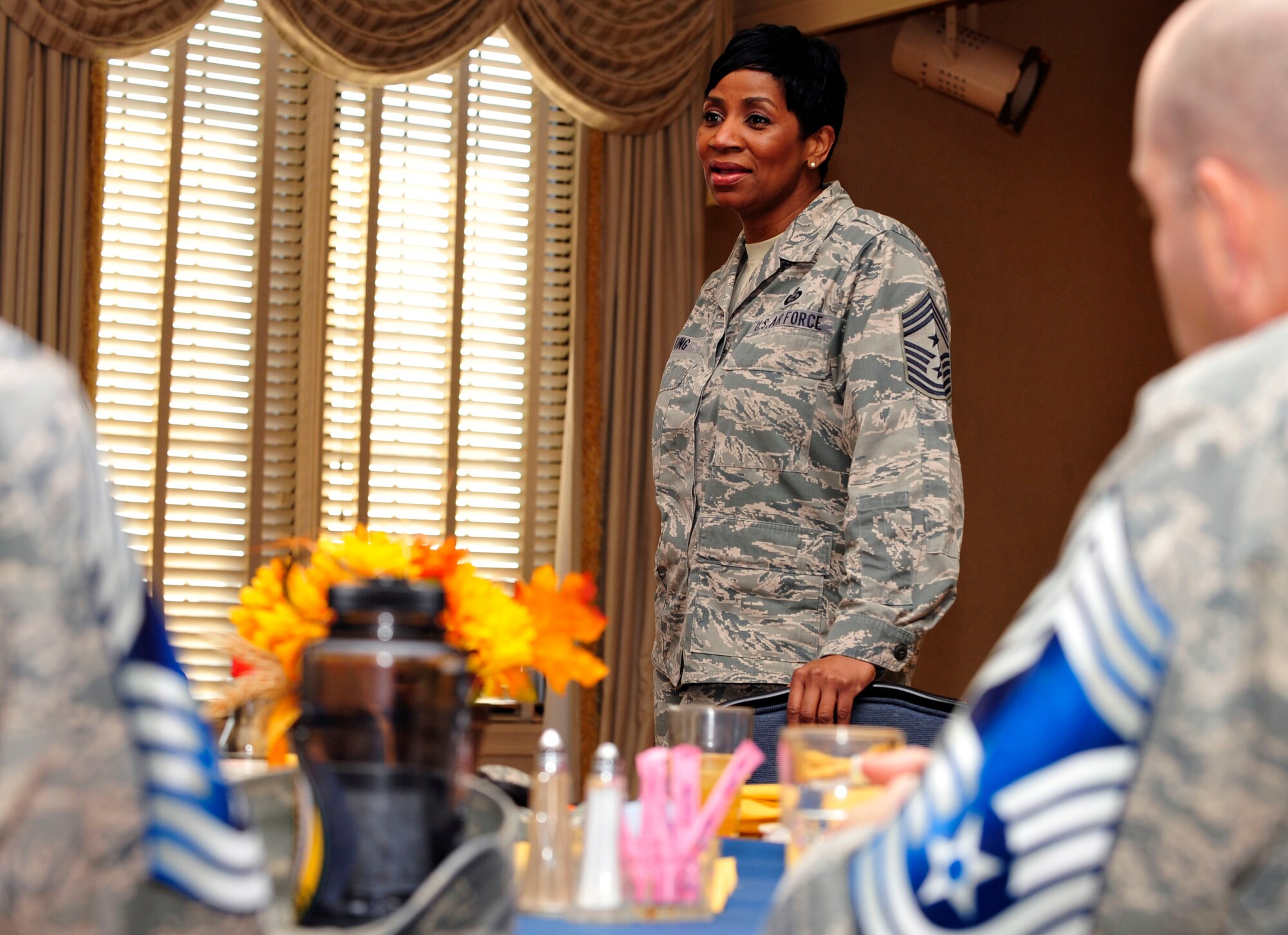U.S. Air Force Chief Master Sgt. Trae King, 633rd Air Base Wing command chief, congratulates seventeen senior master sergeants selected for promotion to chief master sergeant at Langley Air Force Base, Va., Nov. 20, 2014. King’s advice to the newest chief master sergeant selects was to be humble and strive to become a personable chief that all Airmen can talk to. (U.S. Air Force photo by Airman 1st Class Breonna Veal/Released)