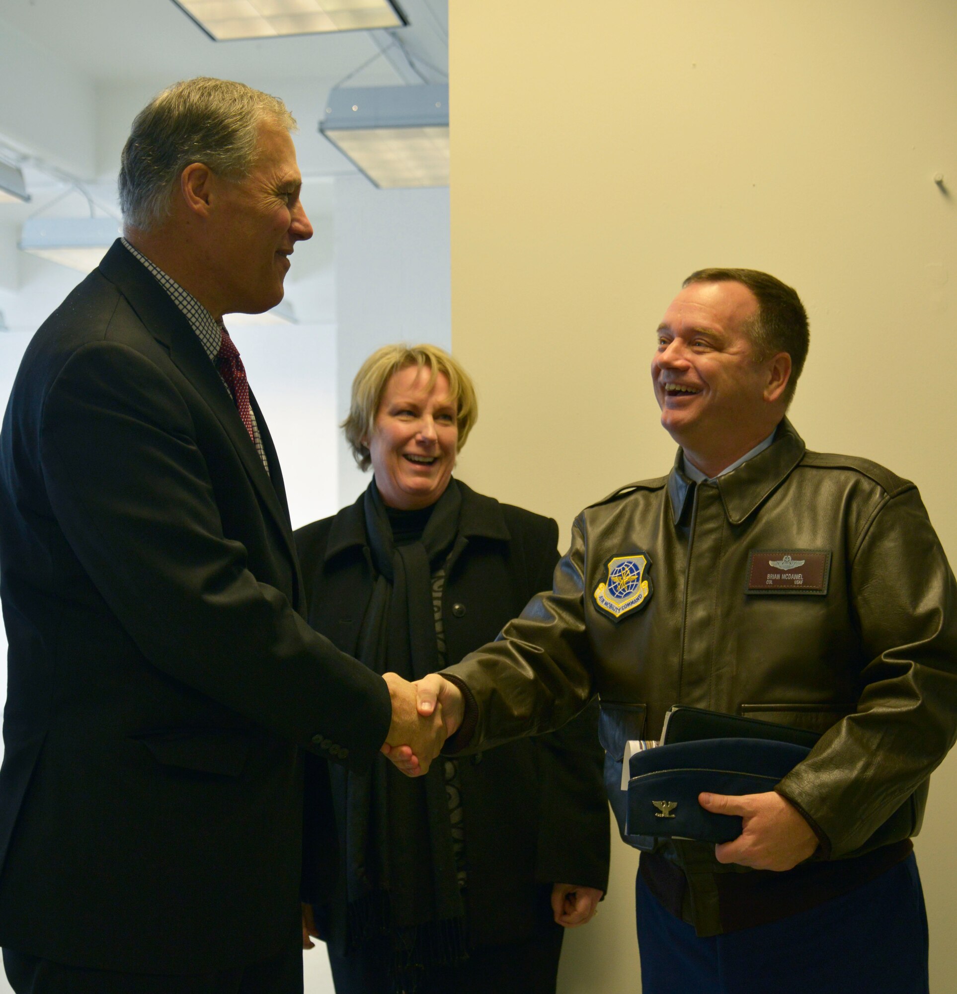 Col. Charles McDaniel, 92nd Air Refueling Wing commander, meets with Jay Inslee, Washington State Governor, during an Aerospace Business Announcement Nov. 20, 2014, at the Spokane International Airport. It was announced that Aero Flite, an aerial wildfire fighting company, will be making its new home at the Spokane International Airport. (U.S. Air Force photo/Airman 1st Class Janelle Patiño)