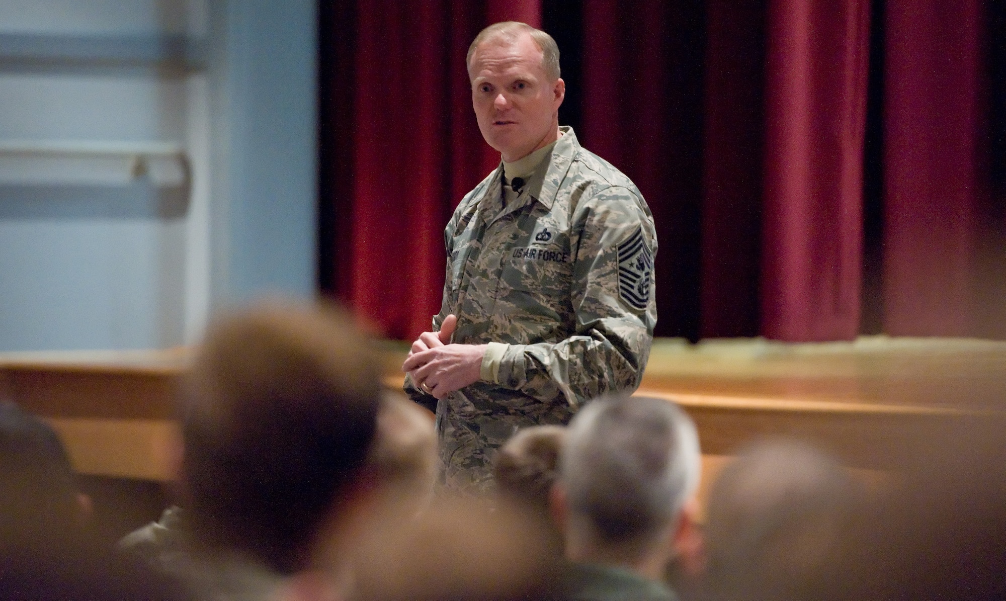 Chief Master Sgt. of the Air Force James Cody speaks to Team Dover members Nov. 18, 2014, at the Base Theater on Dover Air Force Base, Del. Cody spoke on a wide variety of topics concerning the U.S. Air Force as it will be the smallest since 1947 by the end of January 2015. After his briefing that included a question and answer session, he and his wife Athena met with Team Dover and posed for pictures with them. (U.S. Air Force photo/Roland Balik)