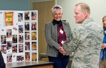 Dawn Nickerson-Banez, 436th Logistics Readiness Squadron honorary commander, talks to Chief Master Sgt. of the Air Force James Cody about the ?Dorm to Gourm? Leadership Pathways Professional Development course Nov. 18, 2014, at the fitness center on Dover Air Force Base, Del. Nickerson-Banez has organized the monthly course since April 2014 that teaches airmen living in the dormitories on how to cook healthy meals for themselves. (U.S. Air Force photo/Roland Balik)