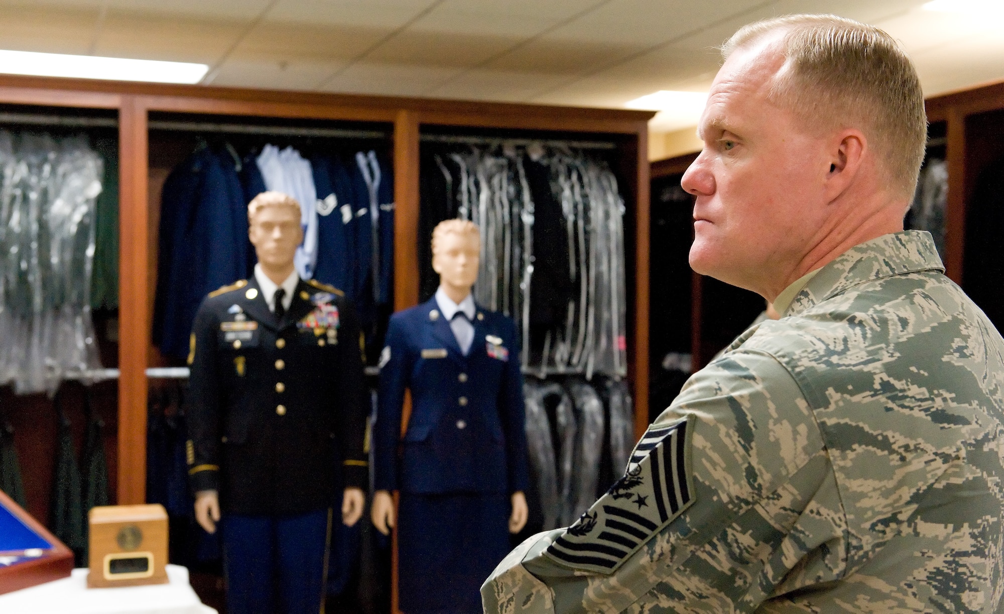 Chief Master Sgt. of the Air Force James Cody takes a moment to look around the uniform section Nov. 18, 2014, at the Charles C. Carson Center for Mortuary Affairs, Dover Air Force Base, Del. Cody and his wife Athena, received a briefing, toured numerous sections and met personnel at Air Force Mortuary Affairs Operations. (U.S. Air Force photo/Roland Balik)
