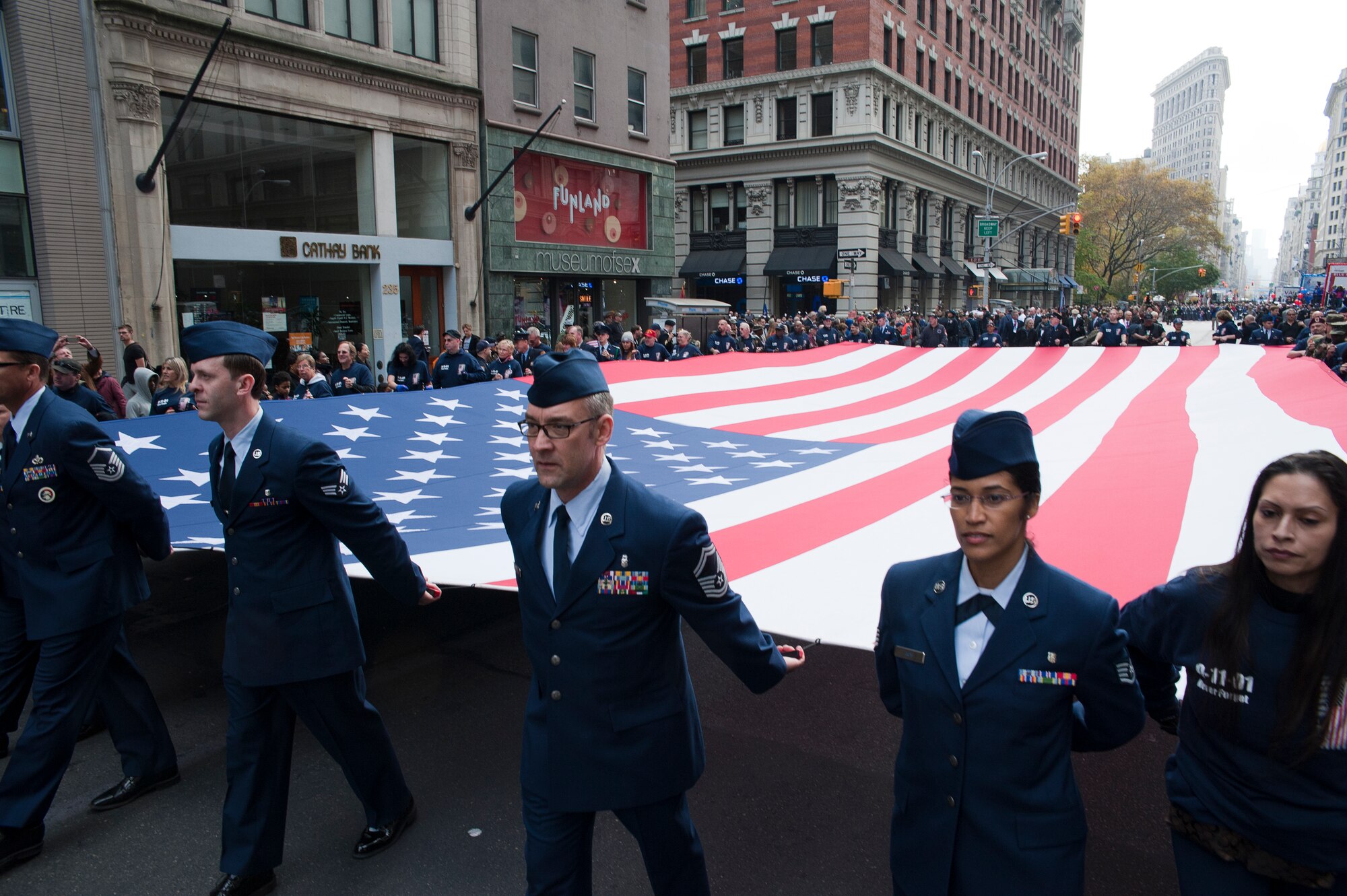 Members of the 514th Air Mobility Wing help carry the Ground Zero Flag down 5th Avenue, New York City, during the annual Veterans Day Parade there November 11. More than 30 Airmen from the wing volunteered to march in the parade which honors veterans of the past and present (US Air Force photo/Christian DeLuca)