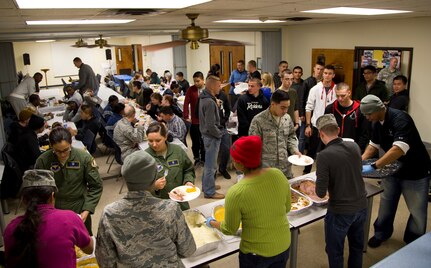 Joint Base San Antonio-Randolph single enlisted Airmen mingle and enjoy a hot Thanksgiving meal provided by the JBSA-Randolph Top 3 Nov. 13 at the JBSA-Randolph Chapel Center. (U.S. Air Force photo by Airman 1st Class Alexandria Slade)
