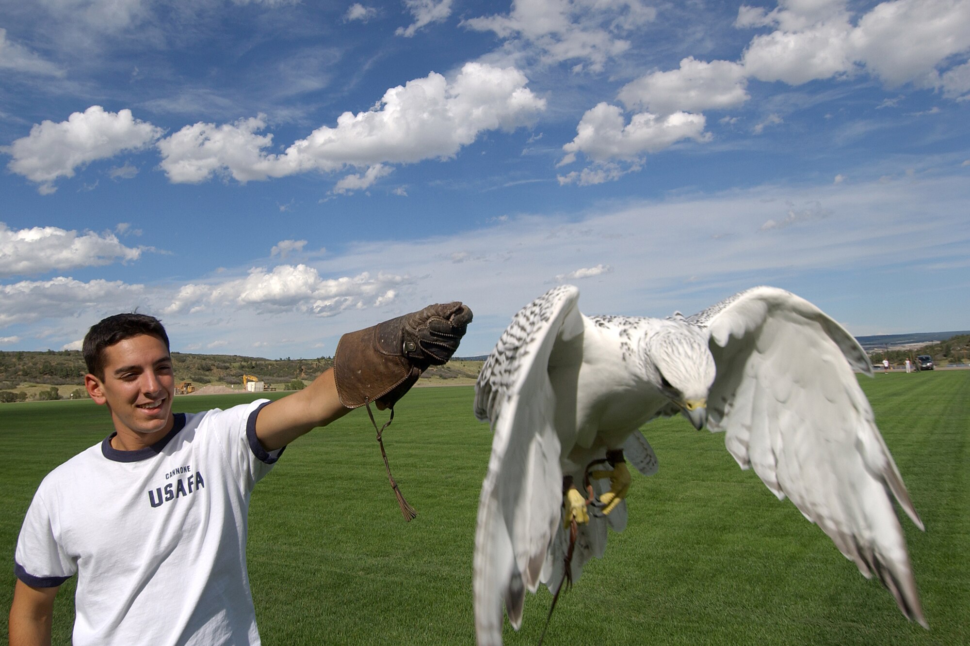 Aurora, an Academy falcon, decelerates onto the glove of then-Cadet 
1st Class Anthony Cannone, an Academy falconer. Aurora will repeat her flying 
performance at the Air Force vs. Colorado State University football game here 
Nov. 28, 2014. The Air Force Academy Athletic Cooperation made more than 2,100 
tickets available to service members and their families at no cost through the 
10th Air Base Wing's Information, Tickets and Tours office. Cannone, a Class 
of '04 grad, is now a captain at Vandenberg Air Force, Calif. (U.S. Air Force 
photo)

