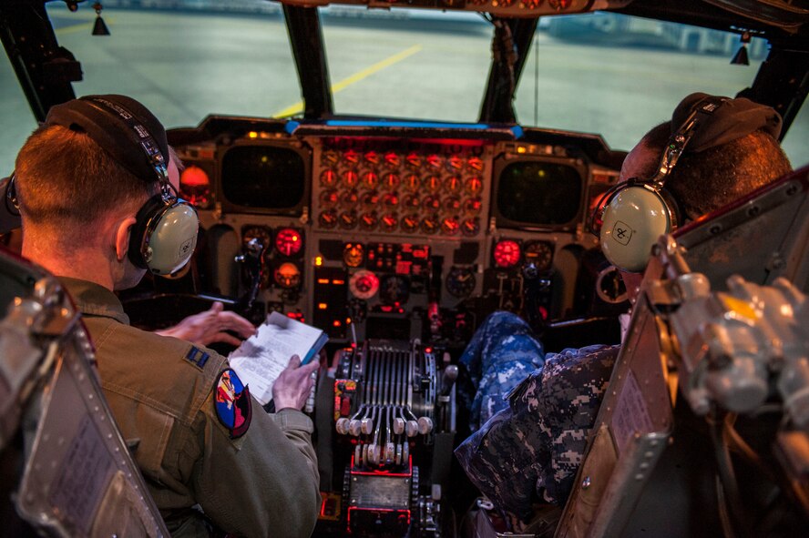 Adm. Cecil D. Haney, U.S. Strategic Command (USSTRATCOM) commander, right, and Capt. Derek Smith, 23rd Bomb Squadron B-52H Stratofortress pilot, fly a mission in the B-52H Stratofortress flight simulator at Minot Air Force Base, N.D., Nov. 17, 2014. As part of his ongoing series of visits with nuclear deterrent forces personnel, Haney witnessed pilot and electronic warfare officers’ perspectives during a virtual bombing mission. The 5th Bomb Wing and 91st Missile Wing at Minot support USSTRATCOM’s nuclear deterrence mission set by operating and maintaining both B-52 Stratofortress bombers and Minuteman III intercontinental ballistic missiles. (U.S. Air Force photo by Senior Airman Stephanie Morris)