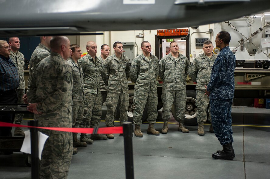 Adm. Cecil D. Haney, United States Strategic Command commander, speaks to Airmen from the 705th Munitions Squadron in the weapons storage area on Minot Air Force Base, N.D., Nov. 17, 2014. As part of his ongoing series of visits with nuclear deterrent forces personnel, Haney viewed 705th MUNS Airmen conducting maintenance and training in both high and low maintenance. The 5th Bomb Wing and 91st Missile Wing at Minot support USSTRATCOM’s nuclear deterrence mission set by operating and maintaining both B-52 Stratofortress bombers and Minuteman III intercontinental ballistic missiles. (U.S. Air Force photo by Senior Airman Stephanie Morris)