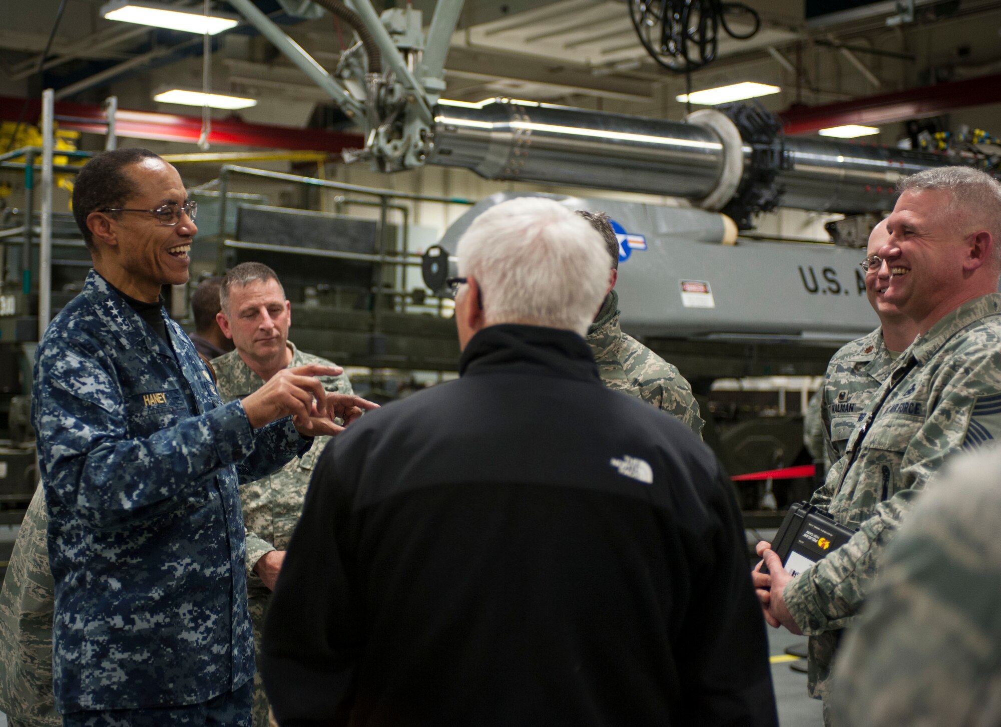 Adm. Cecil D. Haney, U.S. Strategic Command (USSTRATCOM) commander, speaks with Chief Master Sgt. Jeffrey Huber, 705th Munitions Squadron maintenance superintendent, in the weapons storage area at Minot Air Force Base, N.D., Nov. 17, 2014. As part of Haney’s ongoing series of visits with nuclear deterrent forces personnel, he and Huber discussed leadership roles in both supply and management of maintenance operations. The 5th Bomb Wing and 91st Missile Wing at Minot support USSTRATCOM’s nuclear deterrence mission set by operating and maintaining both B-52 Stratofortress bombers and Minuteman III intercontinental ballistic missiles. (U.S. Air Force photo by Senior Airman Stephanie Morris)