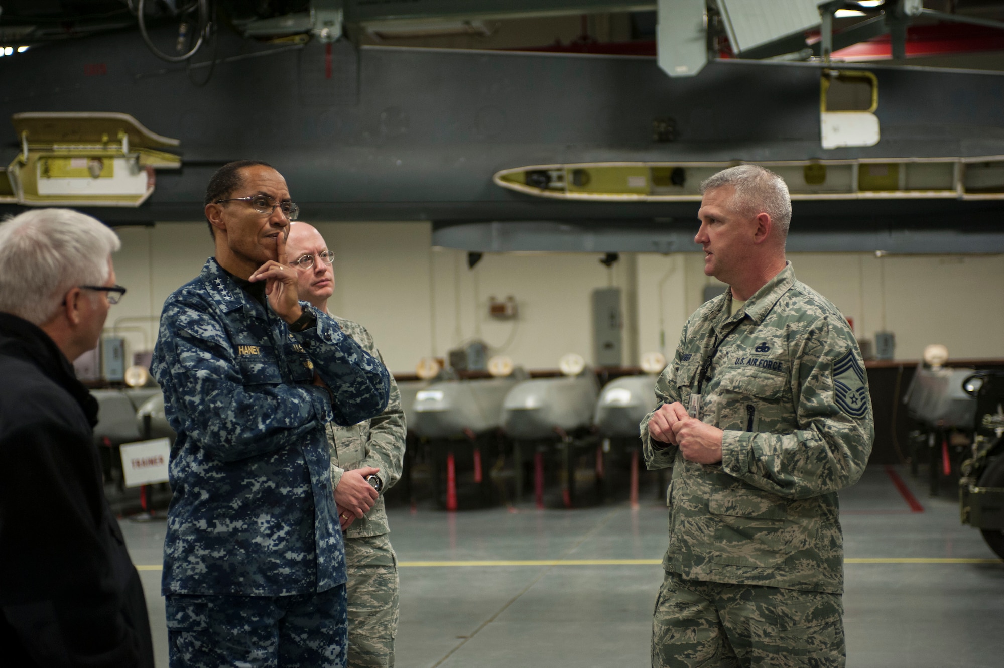 Adm. Cecil D. Haney, U.S. Strategic Command (USSTRATCOM) commander, speaks with Chief Master Sgt. Jeffrey Huber, 705th Munitions Squadron maintenance superintendent, in the weapons storage area at Minot Air Force Base, N.D., Nov. 17, 2014. As part of Haney’s ongoing series of visits with nuclear deterrent forces personnel, he and Huber discussed leadership roles in both supply and management of maintenance operations. The 5th Bomb Wing and 91st Missile Wing at Minot support USSTRATCOM’s nuclear deterrence mission set by operating and maintaining both B-52 Stratofortress bombers and Minuteman III intercontinental ballistic missiles. (U.S. Air Force photo by Senior Airman Stephanie Morris)