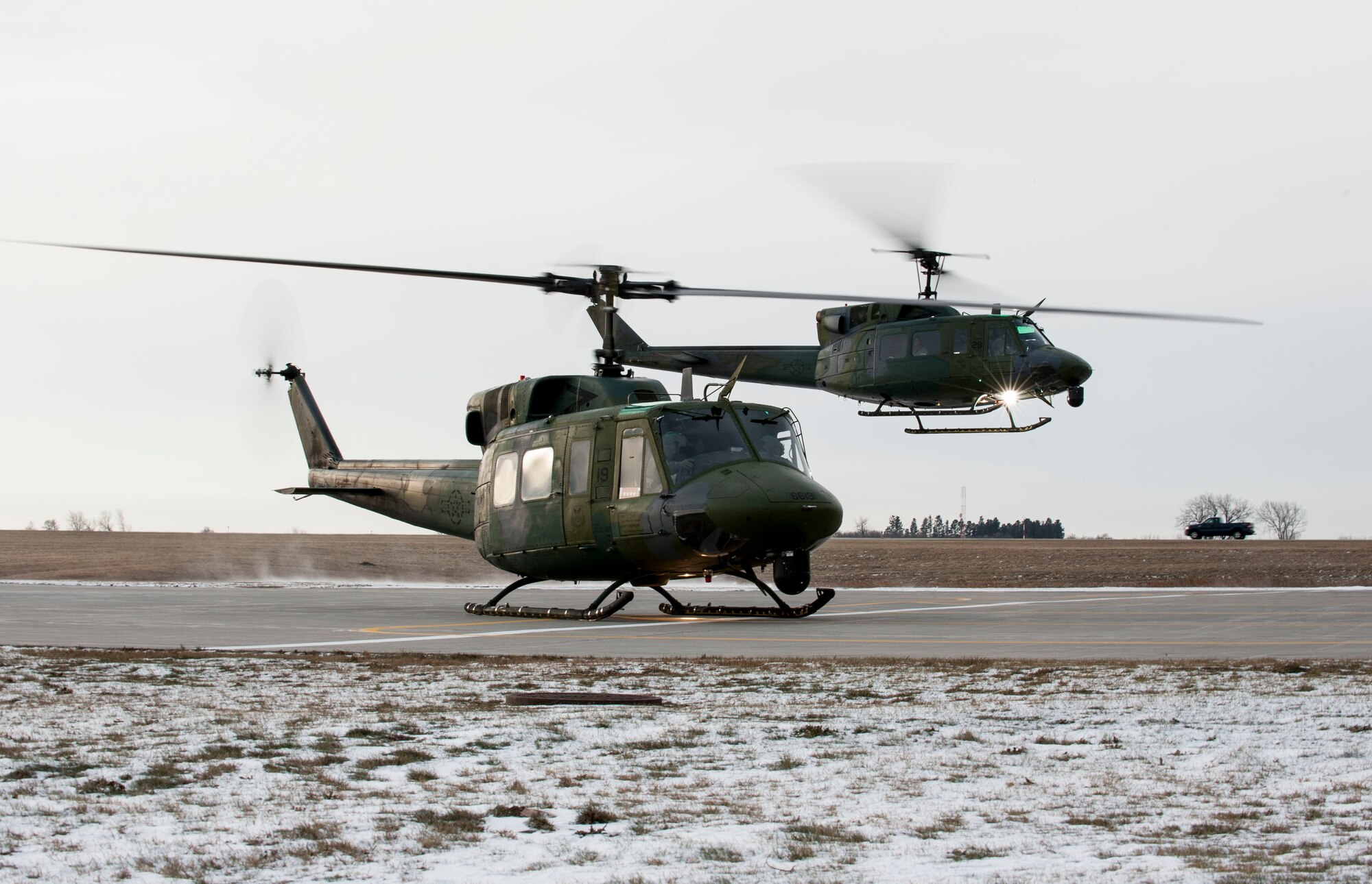 A UH-1 helicopter carrying Adm. Cecil D. Haney, U.S. Strategic Command (USSTRATCOM) commander, takes off from Minot Air Force Base, N.D., Nov. 17, 2014. As part of his ongoing series of visits with nuclear deterrent forces personnel, Haney traveled to the missile field to tour a site and view a demonstration. The 5th Bomb Wing and 91st Missile Wing at Minot support USSTRATCOM’s nuclear deterrence mission set by operating and maintaining both B-52 Stratofortress bombers and Minuteman III intercontinental ballistic missiles. (U.S. Air Force photo by Senior Airman Stephanie Morris)