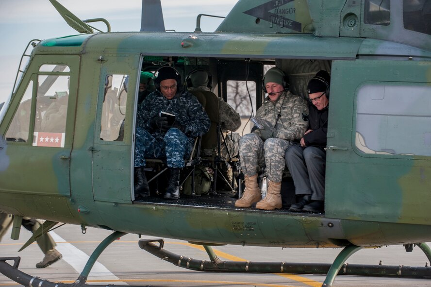 Adm. Cecil D. Haney, U.S. Strategic Command (USSTRATCOM) commander, sits aboard a UH-1 helicopter at Minot Air Force Base, N.D., Nov. 17, 2014. As part of his ongoing series of visits with nuclear deterrent forces personnel, Haney traveled to the missile field to tour a site and view a demonstration. The 5th Bomb Wing and 91st Missile Wing at Minot support USSTRATCOM’s nuclear deterrence mission set by operating and maintaining both B-52 Stratofortress bombers and Minuteman III intercontinental ballistic missiles. (U.S. Air Force photo by Senior Airman Stephanie Morris)