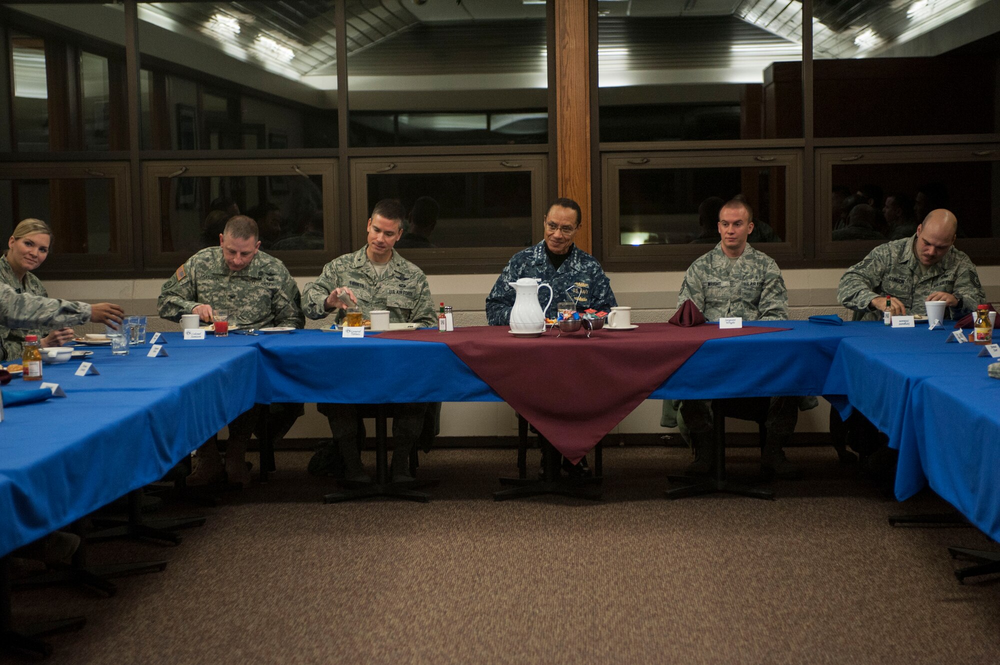 Adm. Cecil D. Haney, U.S. Strategic Command (USSTRATCOM) commander, eats breakfast with Airmen from the 5th Bomb Wing and 91st Missile Wing at Minot Air Force Base, N.D., Nov. 17, 2014. As part of his ongoing series of visits with nuclear deterrent forces personnel, Haney discussed the Airmen’s goals with them and listened to stories about their reasons for joining the Air Force. The 5th Bomb Wing and 91st Missile Wing support USSTRATCOM’s strategic deterrence mission set by operating and maintaining both B-52 Stratofortress bombers and Minuteman III intercontinental ballistic missiles. (U.S. Air Force photo by Senior Airman Stephanie Morris)