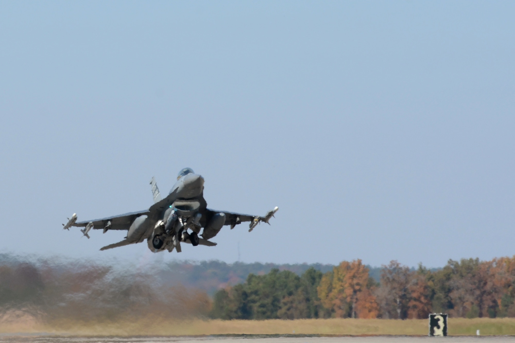 An F-16 from the South Carolina Air National Guard’s 169th Fighter Wing takes off from McEntire Joint National Guard Base as a part of the joint Army and Air National Guard exercise called Carolina Thunder. South Carolina National Guard, along with North Carolina and Georgia National Guard units conducted “Carolina Thunder 14”,  a drill weekend, joint training exercise Nov. 15, 2014. More than 30 aircraft participated in the mass take-off from McEntire Joint National Guard Base, Eastover, S.C. Units conducted air and ground operations at the Savannah River Site in Allendale, S.C. The S.C. Air National Guard 169th Fighter Wing’s F-16 Fighting Falcons joined AH-64D Apaches, CH-47 Chinooks, UH-60 Black Hawks and more than 100 Infantry Soldiers from the S.C. Army National Guard to train with Apaches from the N.C. Army National Guard and the Joint Surveillance Target Attack Radar System (JSATRS) and Joint Terminal Training Center (JTAC) from the Georgia Air National Guard in a collective force-on-force, enemy suppression and assault mission. (U.S. Air National Guard photo by Amn Megan Floyd/Released)