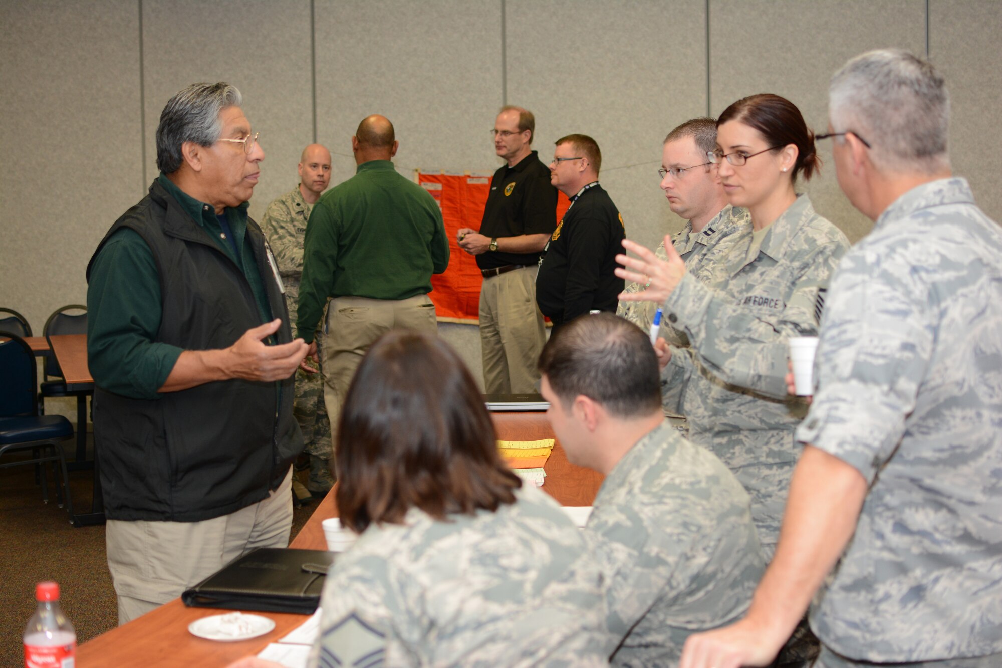 Wisconsin Air National Guard members work with Wisconsin civilian authorities during a unified reception, staging, onward movement and integration exercise at Volk Field Air National Guard Base, Camp Douglas, Wis., Nov. 19, 2014. The URSOI training and exercise event lasted three days and tested the knowledge and response capabilities of Wisconsin’s civilian and military personnel during emergency situations. (U.S. Air National Guard photo by Senior Airman Andrea F. Rhode)