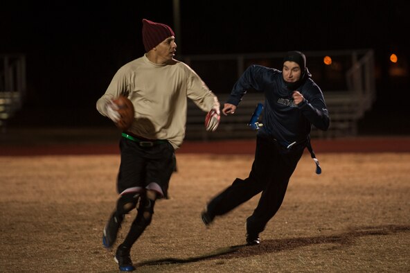 Master Sgt. Michael Brandon, the 19th Maintenance Squadron quarterback, shakes a defender Nov. 17, 2014, at Little Rock Air Force Base, Ark. (U.S. Air Force photo by Senior Airman Kaylee Clark)