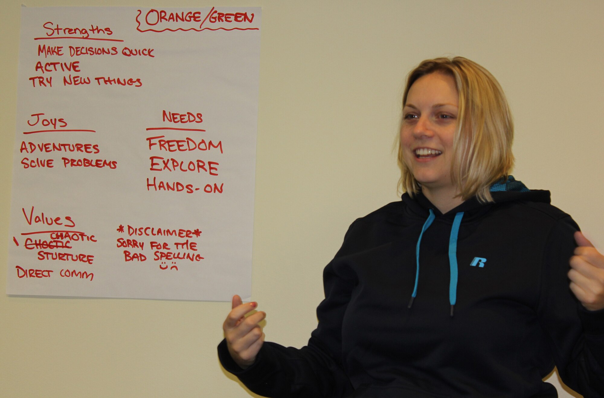 1st Lieutenant Erika Storbeck explains her orange/green colors in “True Colors”, a personality assessment session during a singles relationship and education event in Williamsburg, Va. The retreat provided Airmen an opportunity to learn more about themselves, listen more effectively and improve relationship skills.  The curriculum featured “Got your Back", a training designed to help individuals improve understanding and decision-making in their relationships.  In addition, “True Colors”, a personality assessment tool, was offered along with a Sunday morning chaplain's service. (Courtesy photo/Released)
