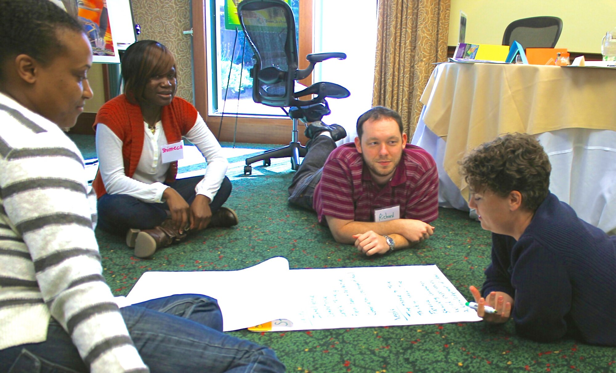 (L-R) Master Sgt. Mikeva Seals, Master Sgt. Shimeca Williams, Staff Sgt. Richard Teller and Tech. Sgt. Dawn Hedges participate in “True Colors”, a personality assessment during a singles relationship and education event in Williamsburg, Va. The retreat provided Airmen an opportunity to learn more about themselves, listen more effectively and improve relationship skills.  The curriculum featured “Got your Back", a training designed to help individuals improve understanding and decision-making in their relationships.  In addition, “True Colors”, a personality assessment tool , was offered along with a Sunday morning chaplain's service. (Courtesy photo/Released)