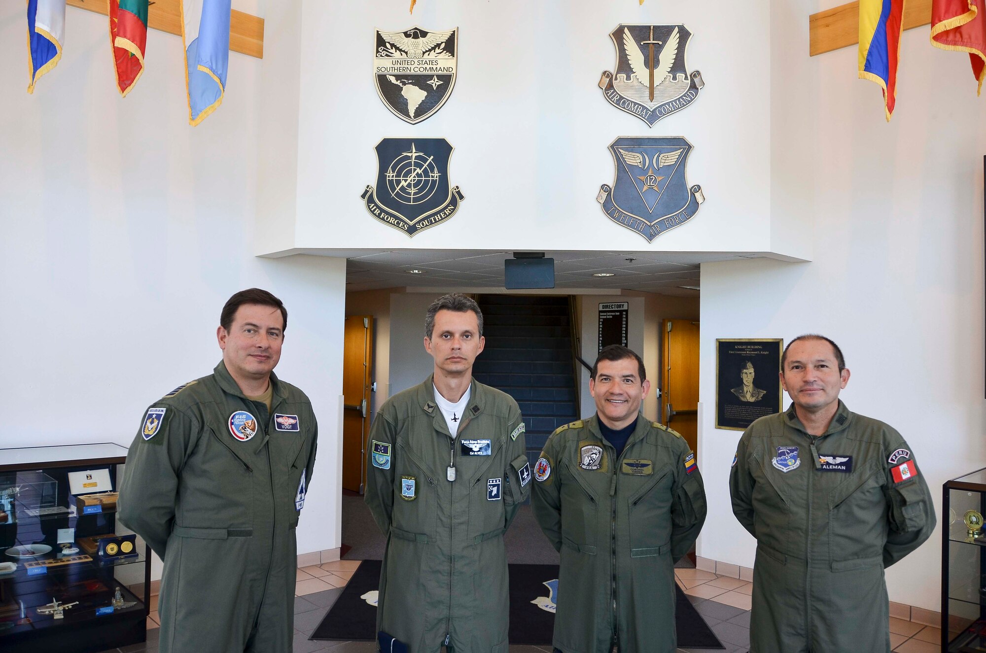 (Left) Colonel Alex Voigt, Air Forces Southern Chilean Liaison Officer, smiles before preparing to execute his daily duties as LNO at Davis-Monthan AFB, Ariz., Oct. 14, 2014. Voigt, who was hand-selected by the top-ranking official in the Chilean air force to serve as the AFSOUTH Chilean LNO, has been serving in the Chilean air force for 30 years. His air force journey officially began at the age of 16, when he started at the Chilean air force academy, but Voigt had dreams of becoming a pilot long before that.  (U.S. Air Force photo by Staff Sgt. Adam Grant/Released)