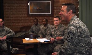 Chief Master Sgt. Vance Kondon, 11th Wing command chief, speaks to a group of Airmen at the first Airmen Professional Enhancement Seminar at Joint Base Andrews, Md., Nov. 19, 2014. Kondon was one of many Team Andrews leaders and supervisors who mentored Airmen on how to have a successful Air Force career. (U.S. Air Force photo/ Senior Airman Nesha Humes)