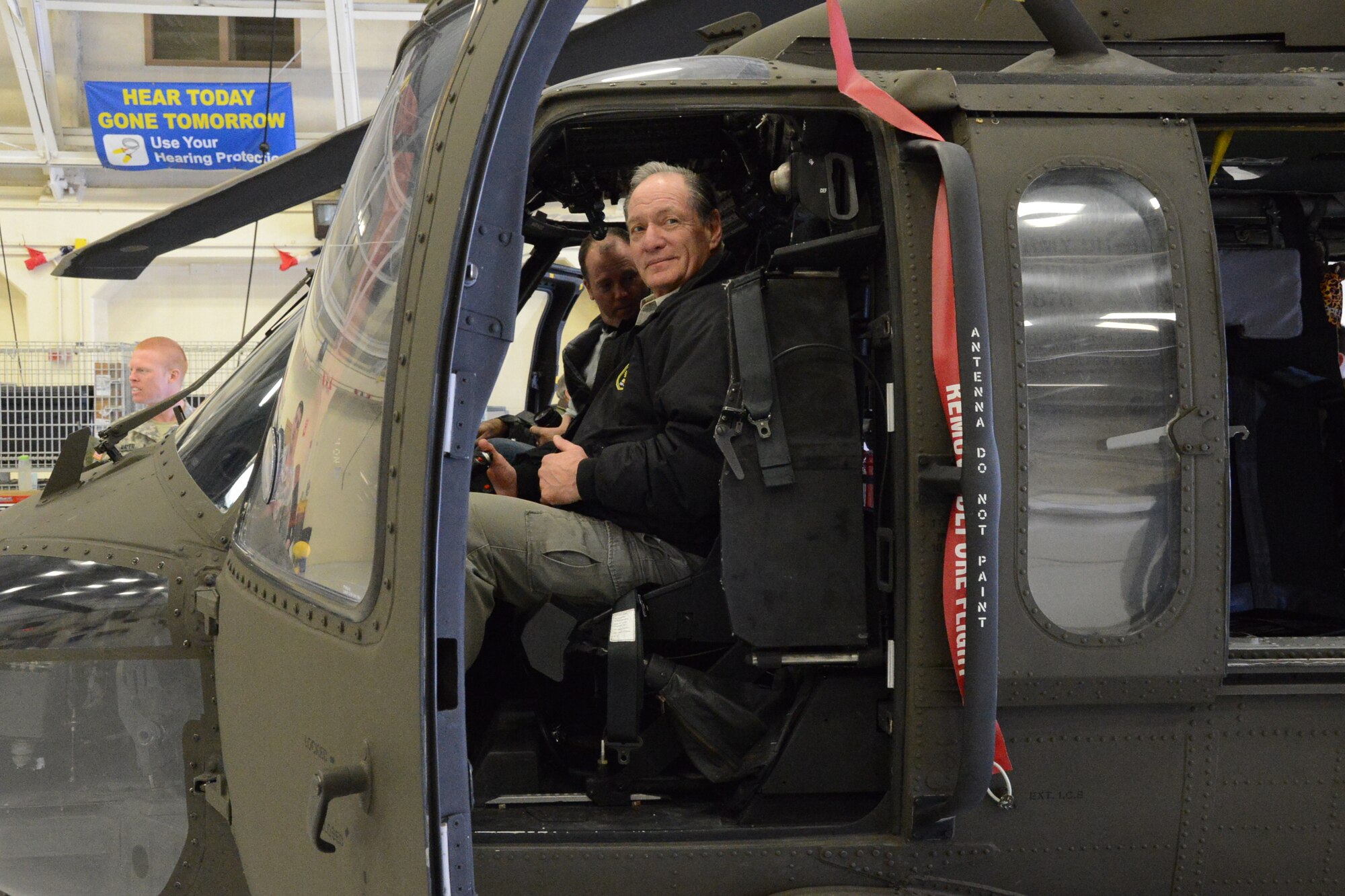 Ted Graziani, chair, CT Employer Support of the Guard and Reserve, poses for a photo while sitting at the controls of a UH-60 Blackhawk during an Employer Support of the Guard and Reserve “bosslift” event at Army Aviation Support Facility, Windsor Locks, Conn., Oct. 28, 2014.  Participants were given tours of both Connecticut Army and Air National Guard facilities and aircraft with the goal providing them with a better understanding and mutual respect of military members and their obligations.  (U.S. Air National Guard photo by Senior Airman Emmanuel Santiago)