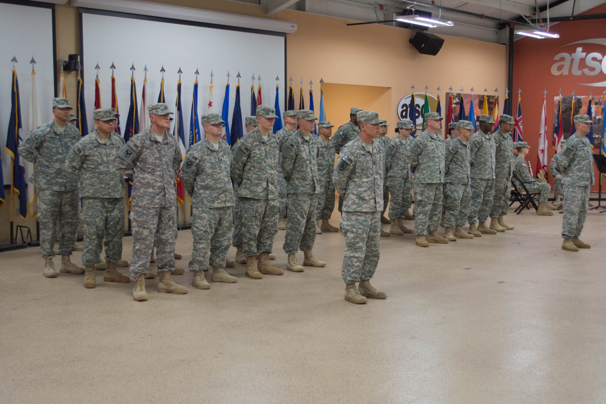 U.S. Army Soldiers from the 97th Transportation Company, 10th Transportation Battalion, 7th Transportation Brigade (Expeditionary), stand in formation during a deployment ceremony at Fort Eustis, Va., Nov. 14, 2014. During their deployment, the Soldiers will conduct water craft missions in support of Operation Enduring Freedom. (U.S. Army photo by Spc. Marian Alleva/Released)