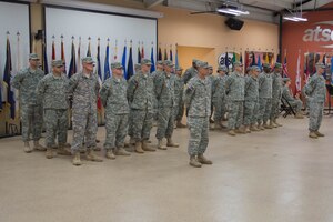 U.S. Army Soldiers from the 97th Transportation Company, 10th Transportation Battalion, 7th Transportation Brigade (Expeditionary), stand in formation during a deployment ceremony at Fort Eustis, Va., Nov. 14, 2014. During their deployment, the Soldiers will conduct water craft missions in support of Operation Enduring Freedom. (U.S. Army photo by Spc. Marian Alleva/Released)