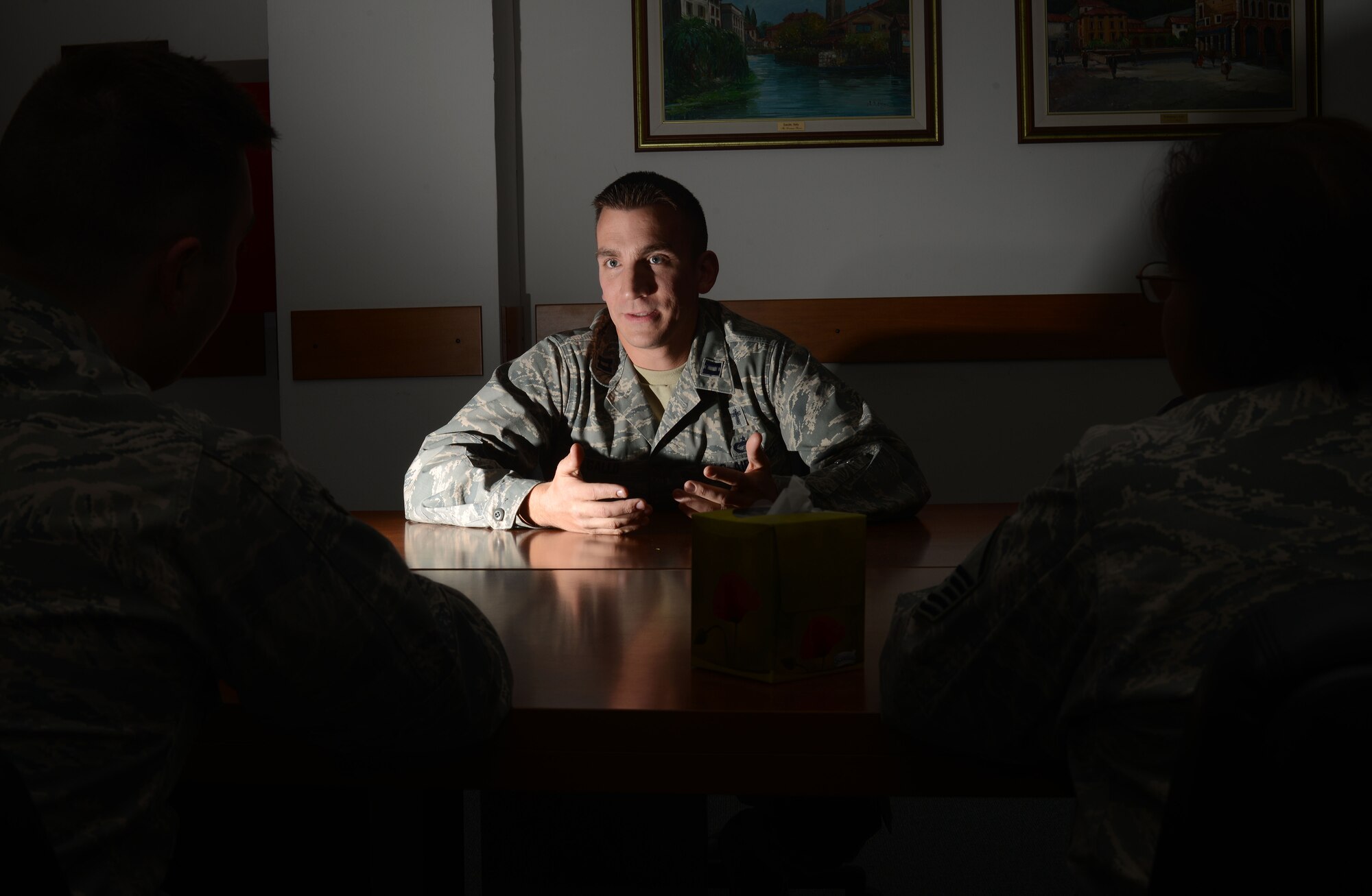 Chaplain (Capt.) Matthew Gallo, 31st Fighter Wing chaplain, speaks with Airmen at Aviano Air Base, Italy Nov. 20,2014.  Gallo created a six-week course to help service members cope with the various stressors that cause grief. The class is designed for participants to lead group forums about what grief is, the process of grief healing and to share their own stories and methods that have helped them cope. (U.S. Air Force photo/Airman 1st Class Deana Heitzman)