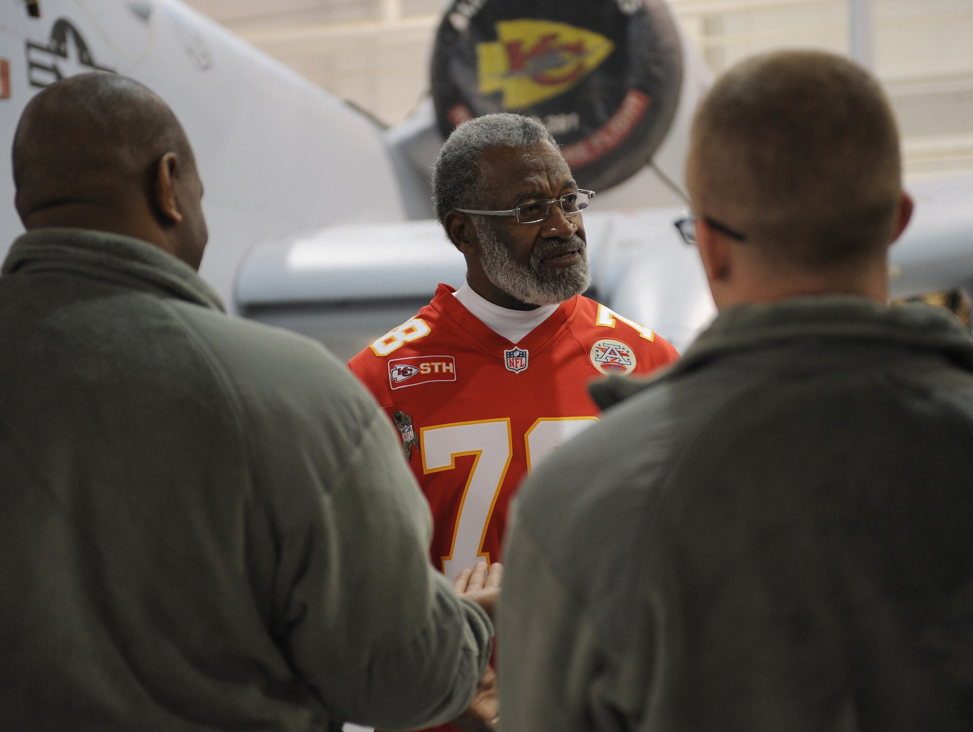 Retired Kansas City Chiefs defensive end Bobby Bell talks with members of Team Whiteman at Whiteman Air Force Base, Mo., Nov. 18, 2014. Bell was inducted into the Chiefs’ Hall of Fame in 1980, and the Pro Football Hall of Fame in 1983. (U.S. Air Force photo by Airman 1st Class Joel Pfiester/Released)
