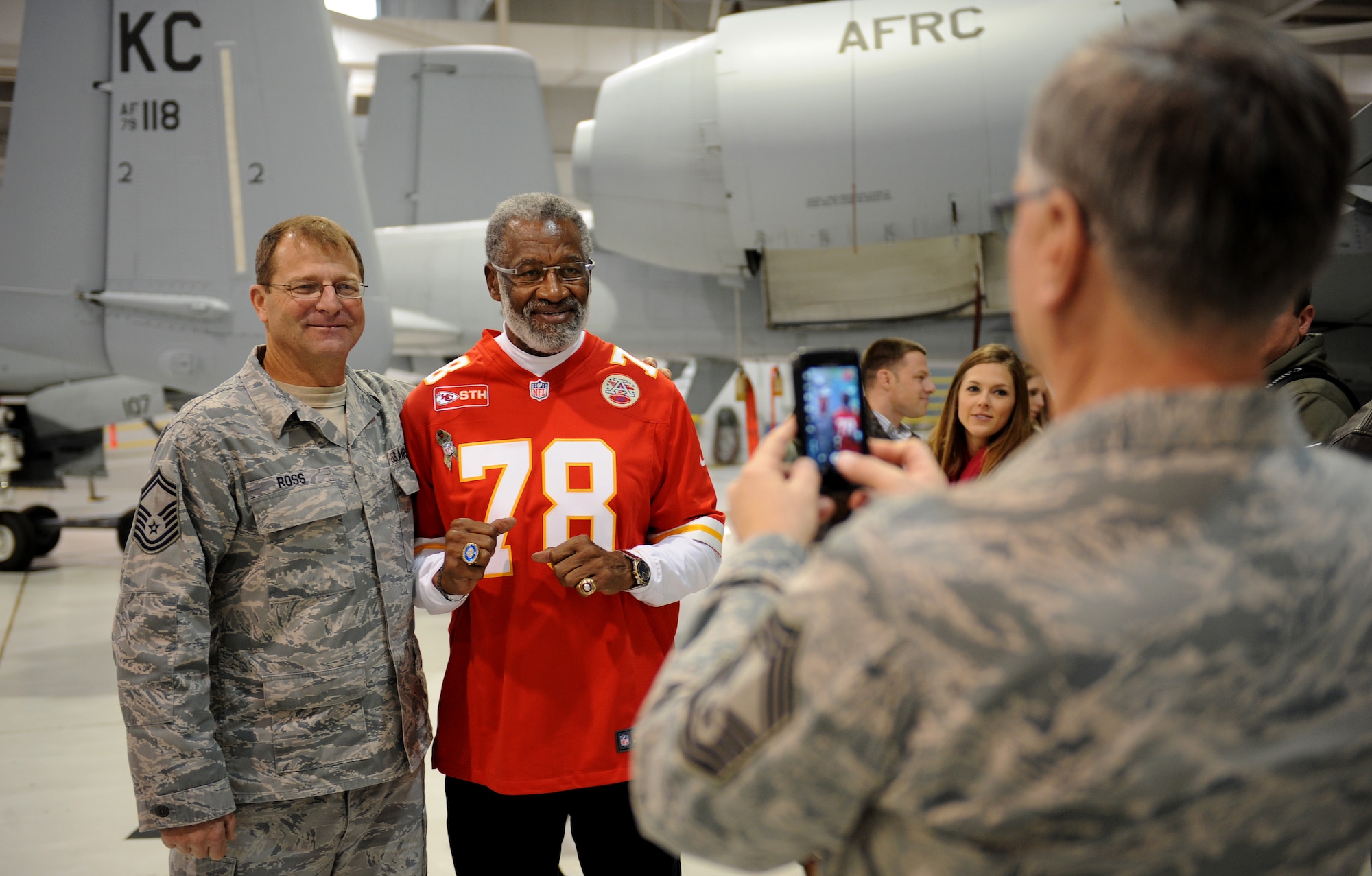 Retired Kansas City Chiefs defensive end Bobby Bell poses for a photo with Senior Master Sgt. Duston Ross, 442nd Aircraft Maintenance Squadron, at Whiteman Air Force Base, Mo., Nov. 18, 2014. Bell was the 16th pick in the second round of the 1963 NFL draft. (U.S. Air Force photo by Airman 1st Class Joel Pfiester/Released)
