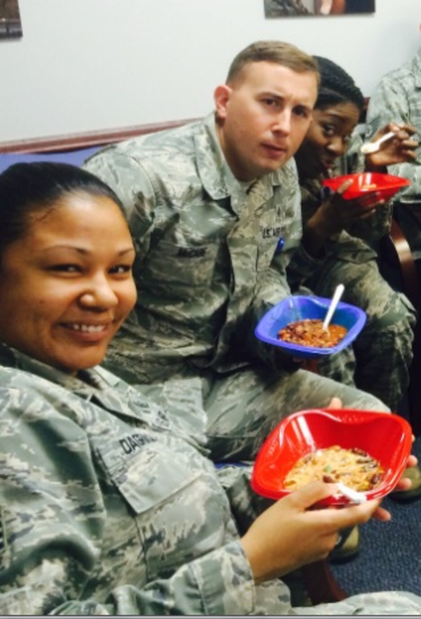 One of the best things about the week is the incredible experience to bond and have fun with the Health Services Management staff at the Joint Base Anacostia-Bolling Clinic.  Staff Sgt. Nicole Dagraca, Staff Sgt. Michael McCabe, and Staff Sgt. Sherella Walker all enjoy winning chili from the cook-off competition.  (AF Photo by Lt. Col. Jose Sorto)