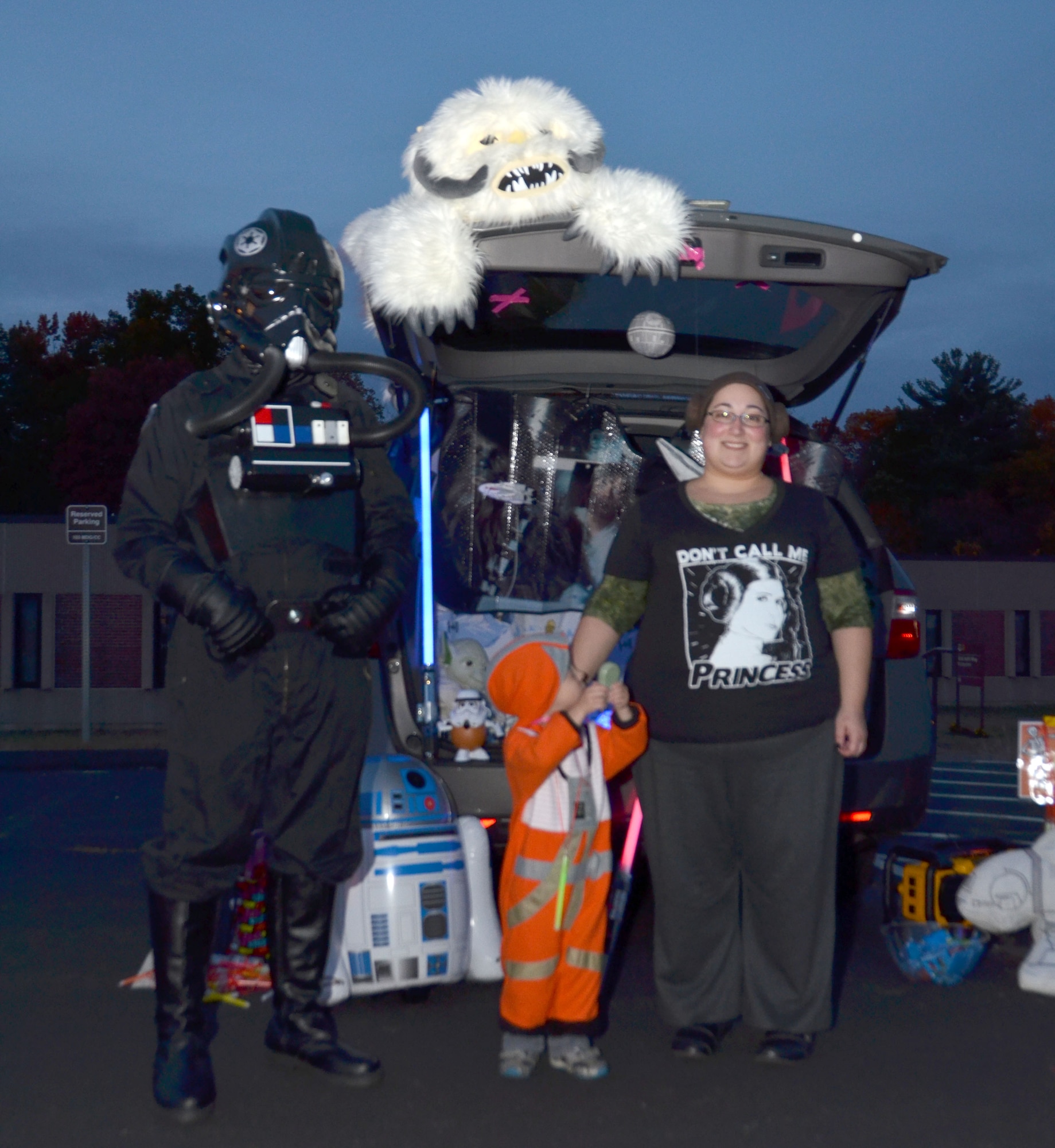 Staff Sgt. Brian Koehler, a supply sergeant with the Connecticut Army National Guard, dressed as a “Tie Fighter pilot”, and Jessica Koehler, family assistance center specialist, dressed in “Princess Leia” gear, pose with their son Owen, 4, who is dressed as an “X-Wing Fighter pilot” during the Child and Youth Program’s Trunk or Treat event held at Bradley Air National Guard Base, East Granby, Conn., Oct. 28, 2014.  . (U.S. Air National Guard photo by Tech. Sgt. Joshua Mead)