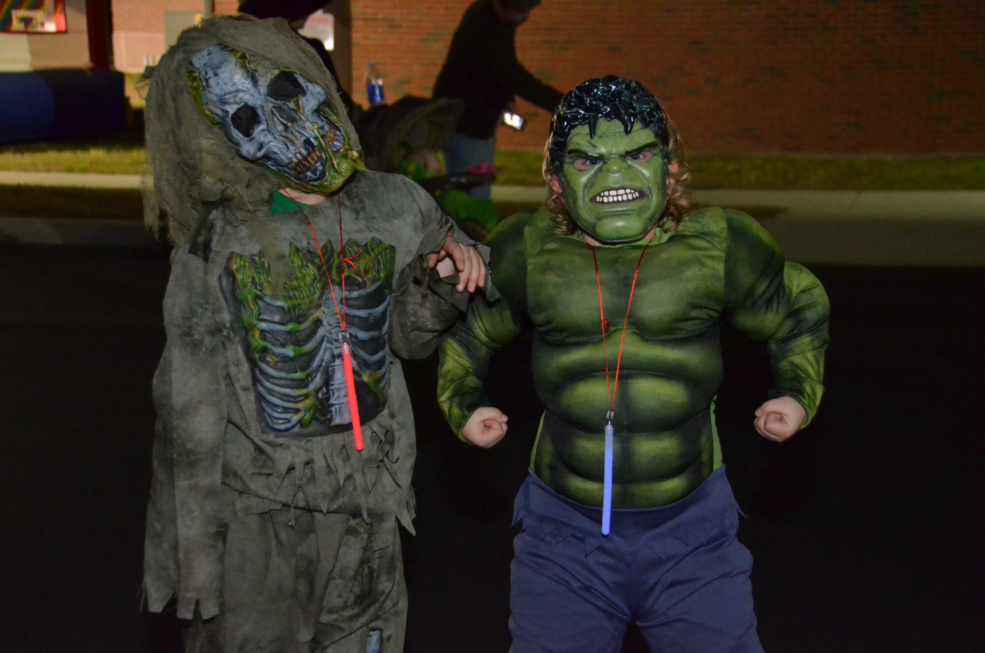 The “hulk” and grotesque zombie, who are actually Tyeler, 8, and Codey, 5, children of Master Sgt. Rose Wilson from the 103rd Logistics Readiness Squadron, show off their Halloween moves during the Child and Youth Program’s Trunk or Treat event held at Bradley Air National Guard Base, East Granby, Conn., Oct. 28, 2014. The event drew a variety of Halloween characters to trick or treat from various car trunks decorated in the Halloween fashion. (U.S. Air National Guard photo by Tech. Sgt. Joshua Mead)